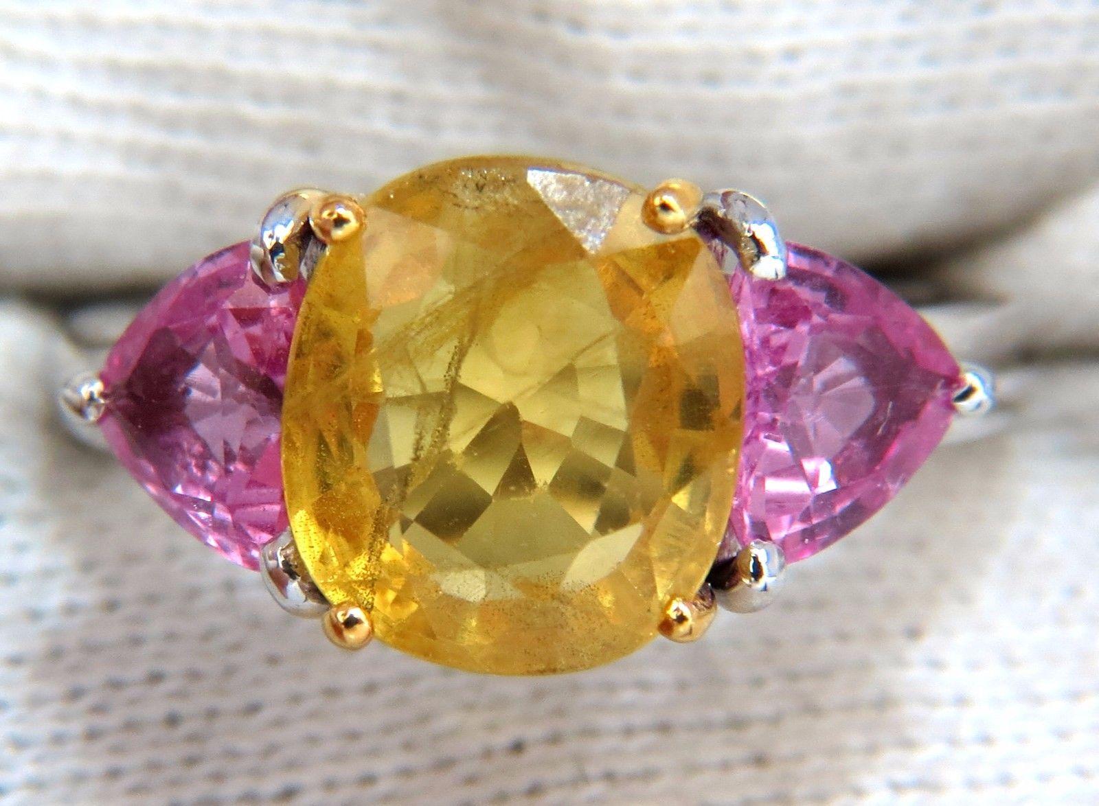 Natural Yellow Sapphire diamonds ring.

4.45ct. Natural yellow Sapphire

4.59 X 8.97 x 10.06mm 

Full cut cushion brilliant 

Semi Clean Clarity & Transparent



2.10 natural (2) pink sapphires on sides

Clean clarity & transparent

Vivid pinks,