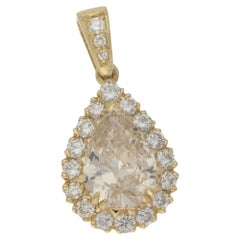 6.55 Carat Pear Fancy Yellow Diamond Cluster Pendant with Sixteen Halo Diamonds