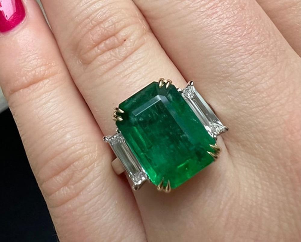Emerald Weight: 6.57 ct, Measurements: 20 x 13.5 mm, Diamond Weight: 0.54 ct, Metal: Platinum/18K Yellow Gold Basket, Ring Size: 7, Shape: Emerald-Cut, Color: Green, Hardness: 7.5-8, Birthstone: May, CD Certified