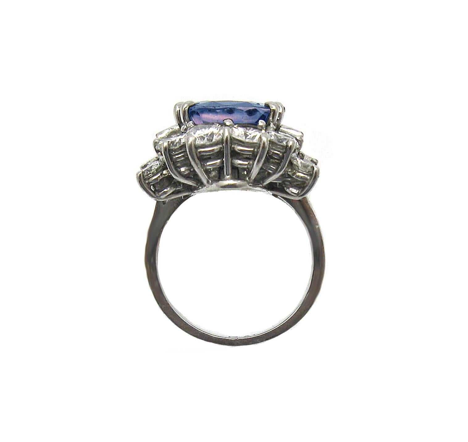 This creative sapphire and diamond piece will serve you two ways: as a ring or a pendant! Featuring a 6.57ct cushion cut Sapphire, un-heated and GIA certified. The center sapphire is framed by 16 baguette and round diamonds totaling over 3.20ct,