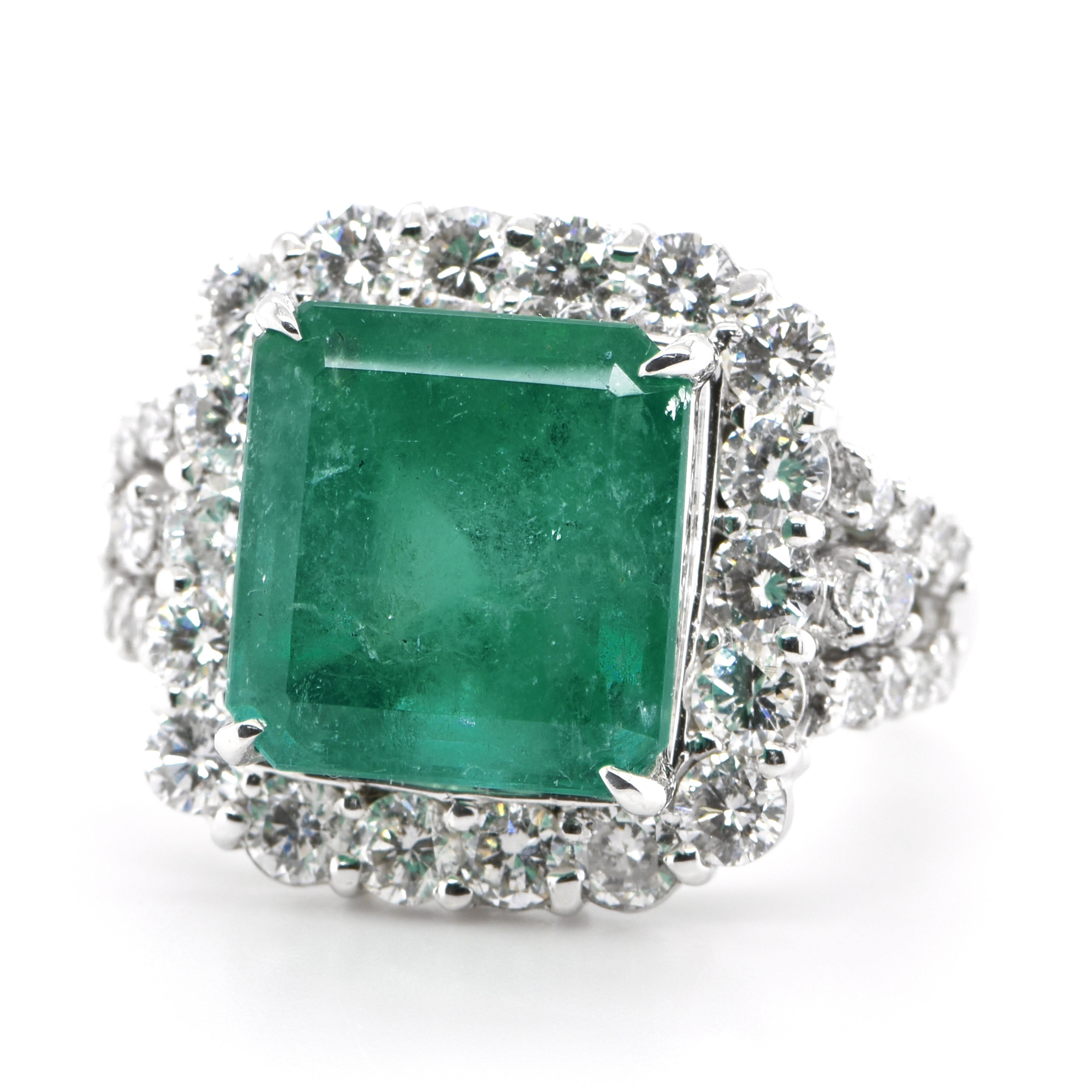 A stunning ring featuring a 6.577 Carat Natural Emerald and 1.60 Carats of Diamond Accents set in Platinum. People have admired emerald’s green for thousands of years. Emeralds have always been associated with the lushest landscapes and the richest