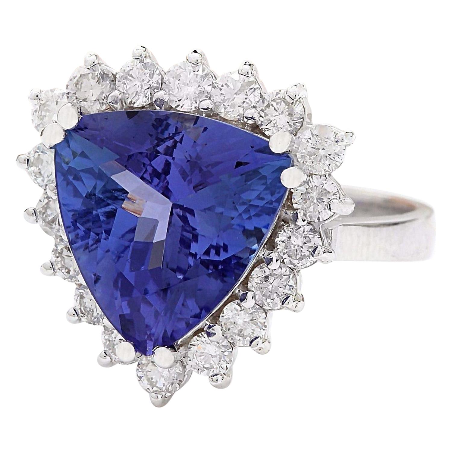 Introducing our captivating 6.57 Carat Natural Tanzanite 14K Solid White Gold Diamond Ring, a true marvel of craftsmanship and beauty. This exquisite piece is meticulously crafted from 14K white gold, exuding luxury and sophistication. At its heart