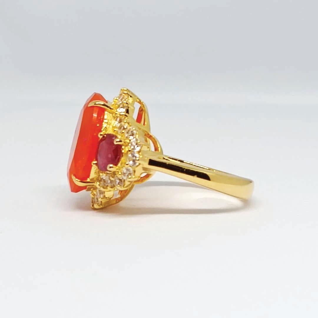 Oval Cut 6.57cts Orange Opal ring. Sterling Silver on 18K Gold Plated. For Sale