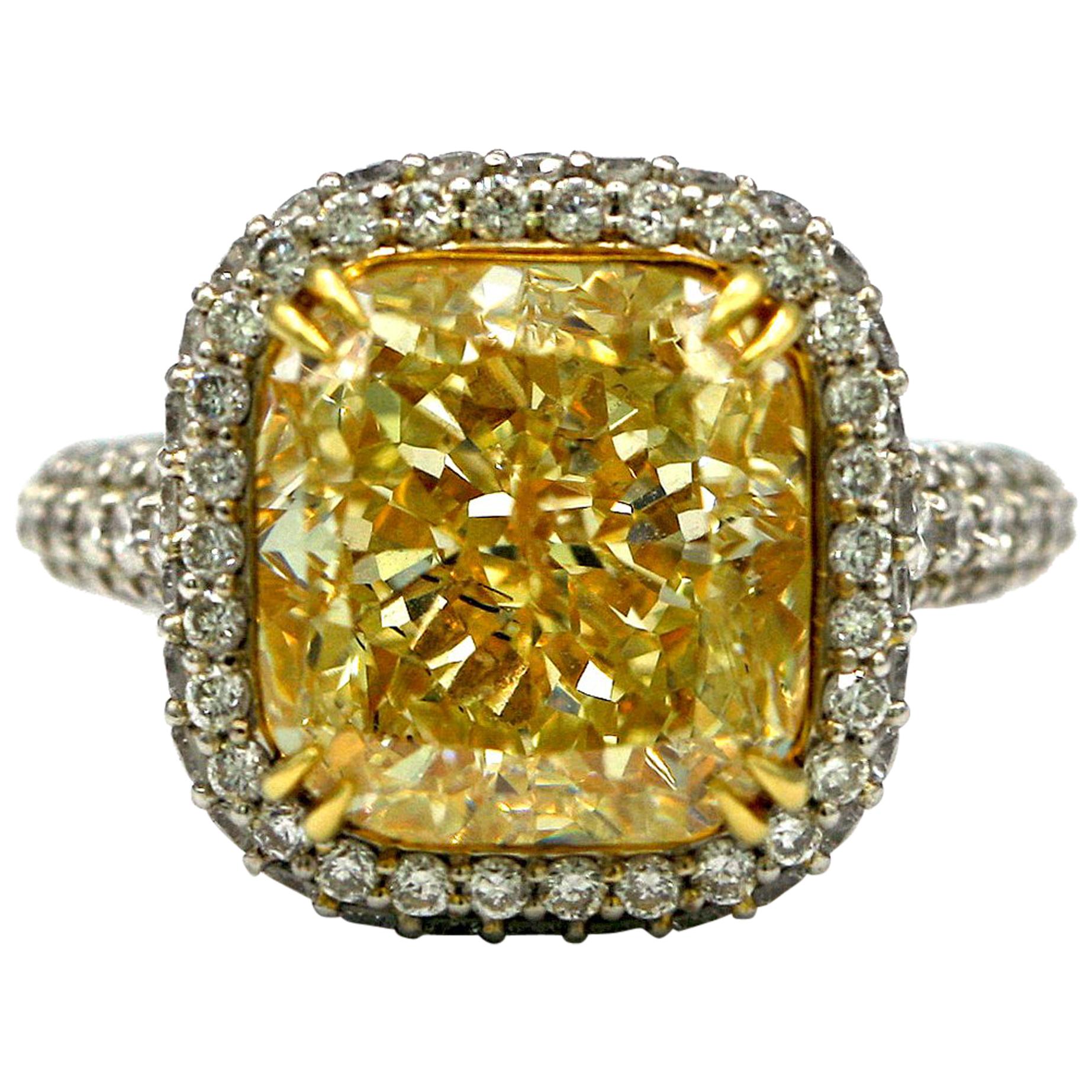 6.58 Carat EGL Fancy Light Yellow Cushion SI2 with Pave Diamonds Platinum Ring For Sale
