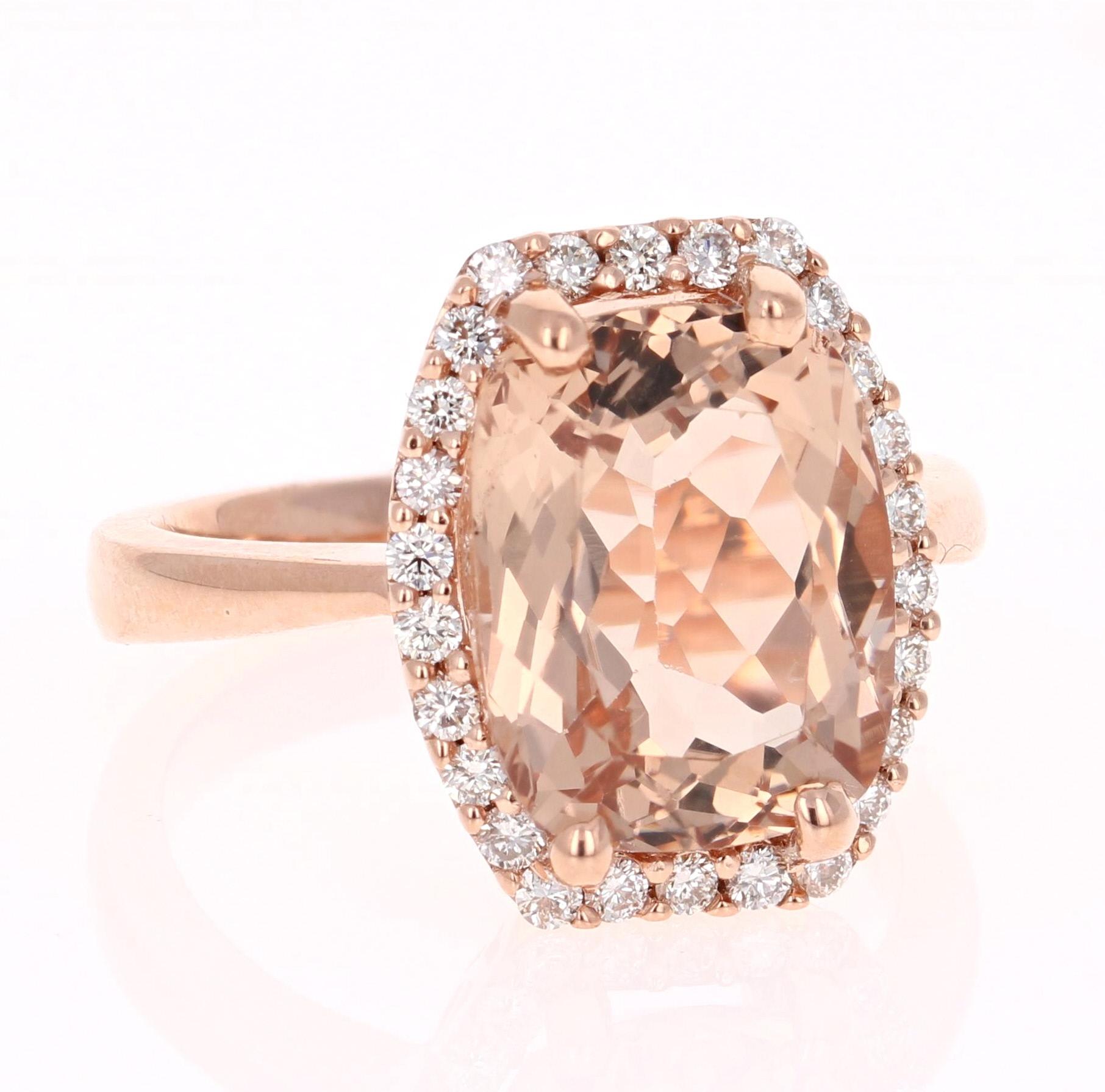 A lovely Engagement Ring Option! This simple yet gorgeous Morganite Ring has a 6.16 Carat Cushion Cut Morganite as its center and has a beautiful simple halo of 26 Round Cut Diamonds that weigh 0.42 carats. The total carat weight of the ring is 6.58