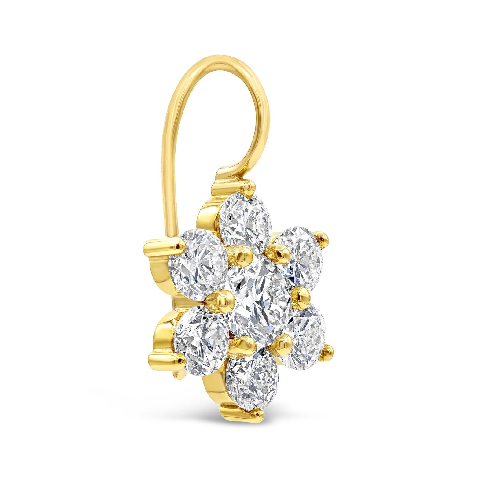 A brilliant and stylish pair of earrings showcasing round brilliant diamonds, set in a floral motif design. Diamonds are approximately H color and SI1 clarity and weigh 6.58 carats total. Made in 18K yellow gold. 

Style available in different price