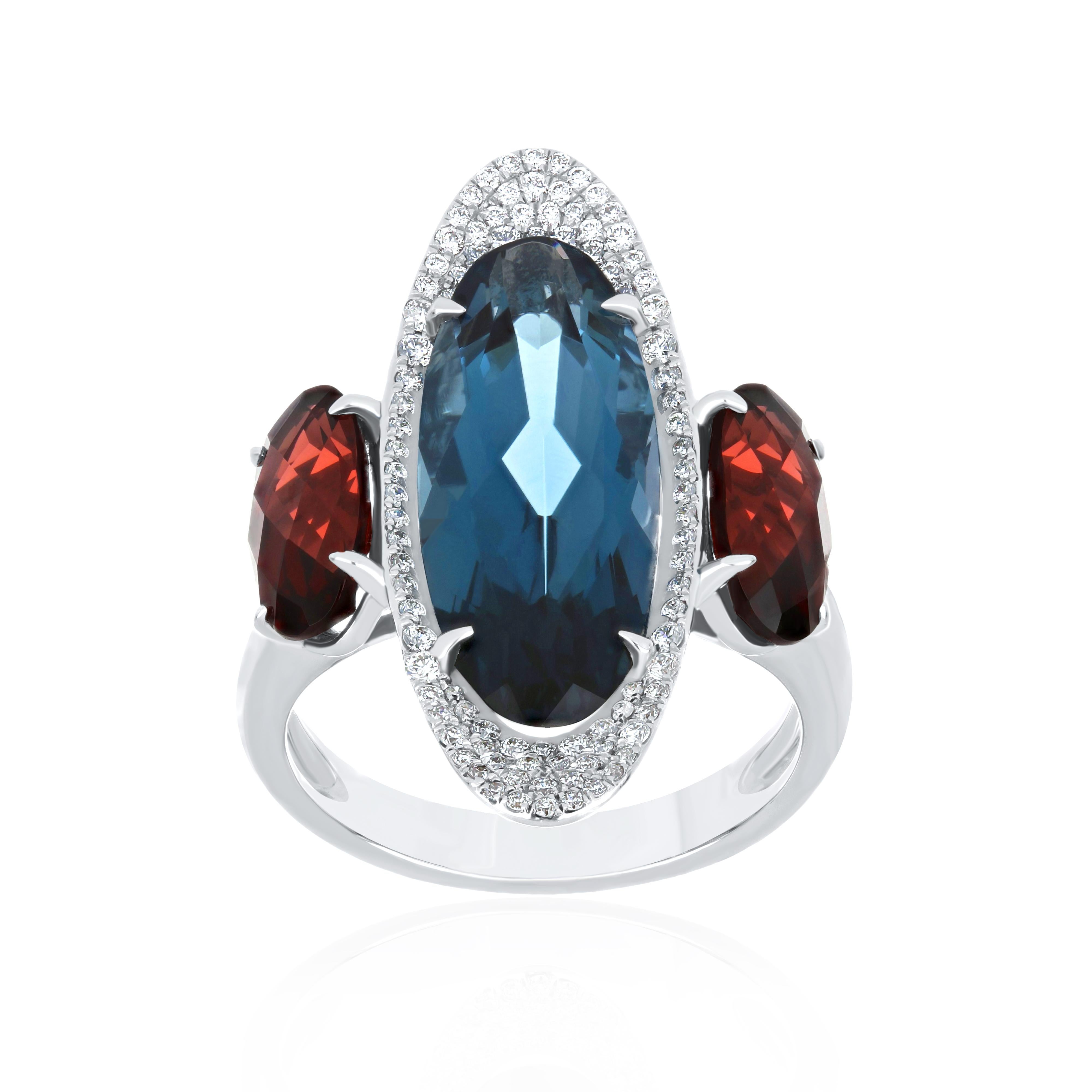 Elegant and exquisitely detailed 14 Karat White Gold Ring, Fancy Elongated Oval Shape London Blue Topaz weight 6.58Cts(approx.), Oval Shape Garnet weight 3.32Cts(approx.), accented with micro pave Diamond 0.358Cts (approx.) Beautifully Hand crafted