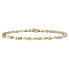 Bracciale tennis con diamanti a forma di pera bianchi e gialli alternati da 6,5 carati