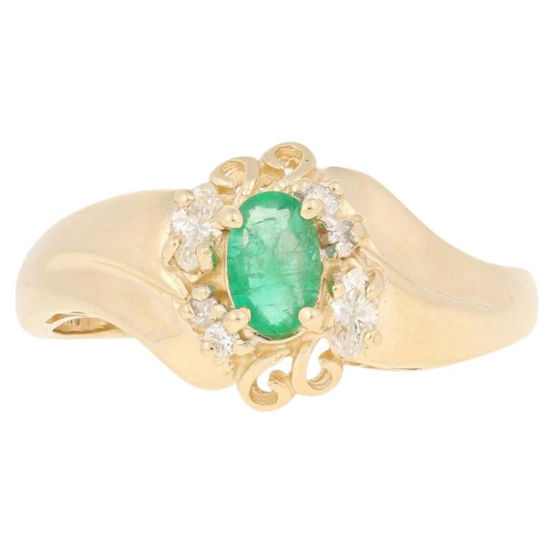 .65ctw Oval Cut Emerald & Diamond Ring, 14k Yellow Gold Bypass