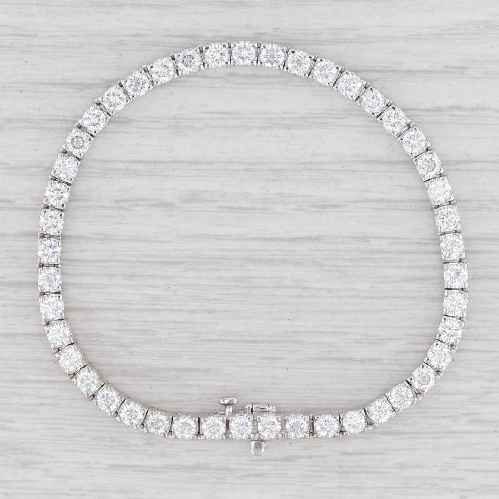 Gem: Natural Diamonds - 6.50 Total Carats, Round Brilliant Cut, G - I Color, VS2 Clarity
Metal: 18k White Gold
Weight: 17.3 Grams 
Stamps: 18k, 35
Style: Tennis Bracelet
Closure: Slide & Latch
Inner Circumference: 7 1/4