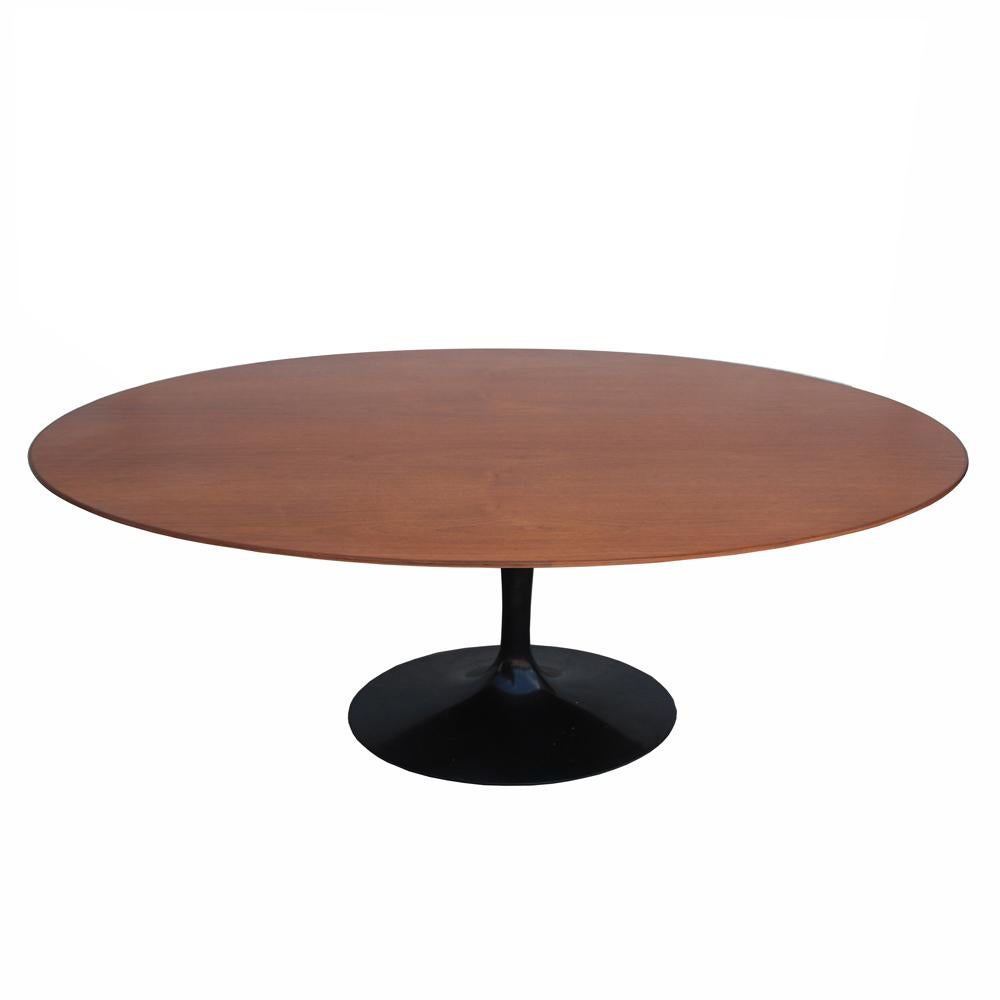 6.5ft Knoll oval teak table with ebonized Saarinen tulip base

 
A dining table with a black enameled cast iron oval pedestal tulip base and a rare teak top. 
Based marked.
 
Size: 78