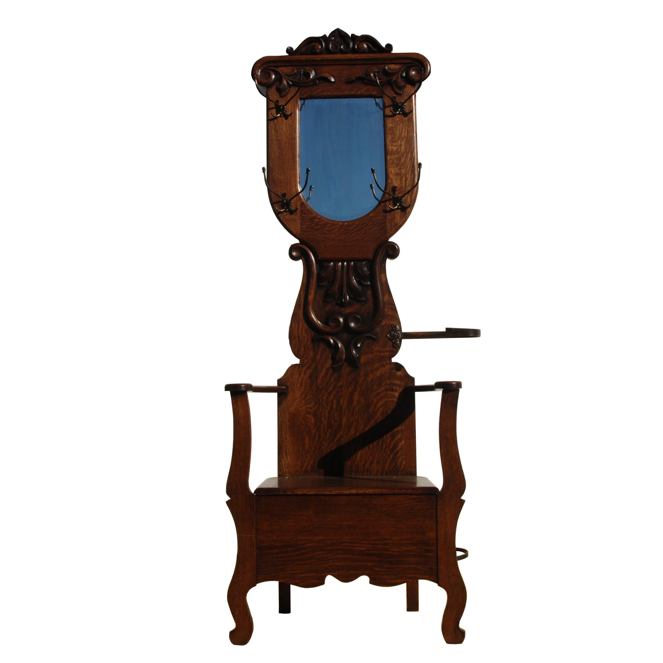 6.5ft Victorian era tiger oak hall tree with storage bench 

Eastlake/Victorian hall tree with seating, storage compartment underneath seat, and umbrella holder.
Has multiple hooks as well. 

 