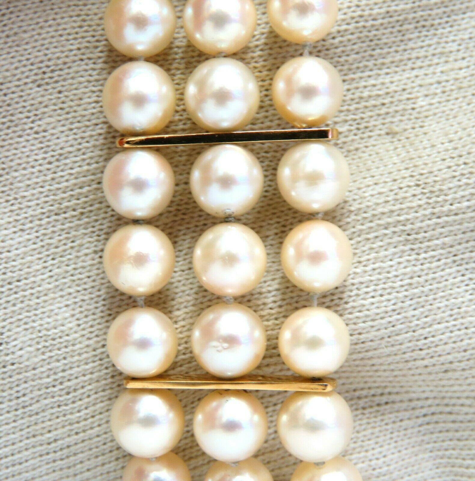 6.5 mm Akoya pearls bracelet.

Three stranded and bar linked.

20mm wide.

14 karat yellow gold

7.5 in Long

Comfortable stud beaded clasp