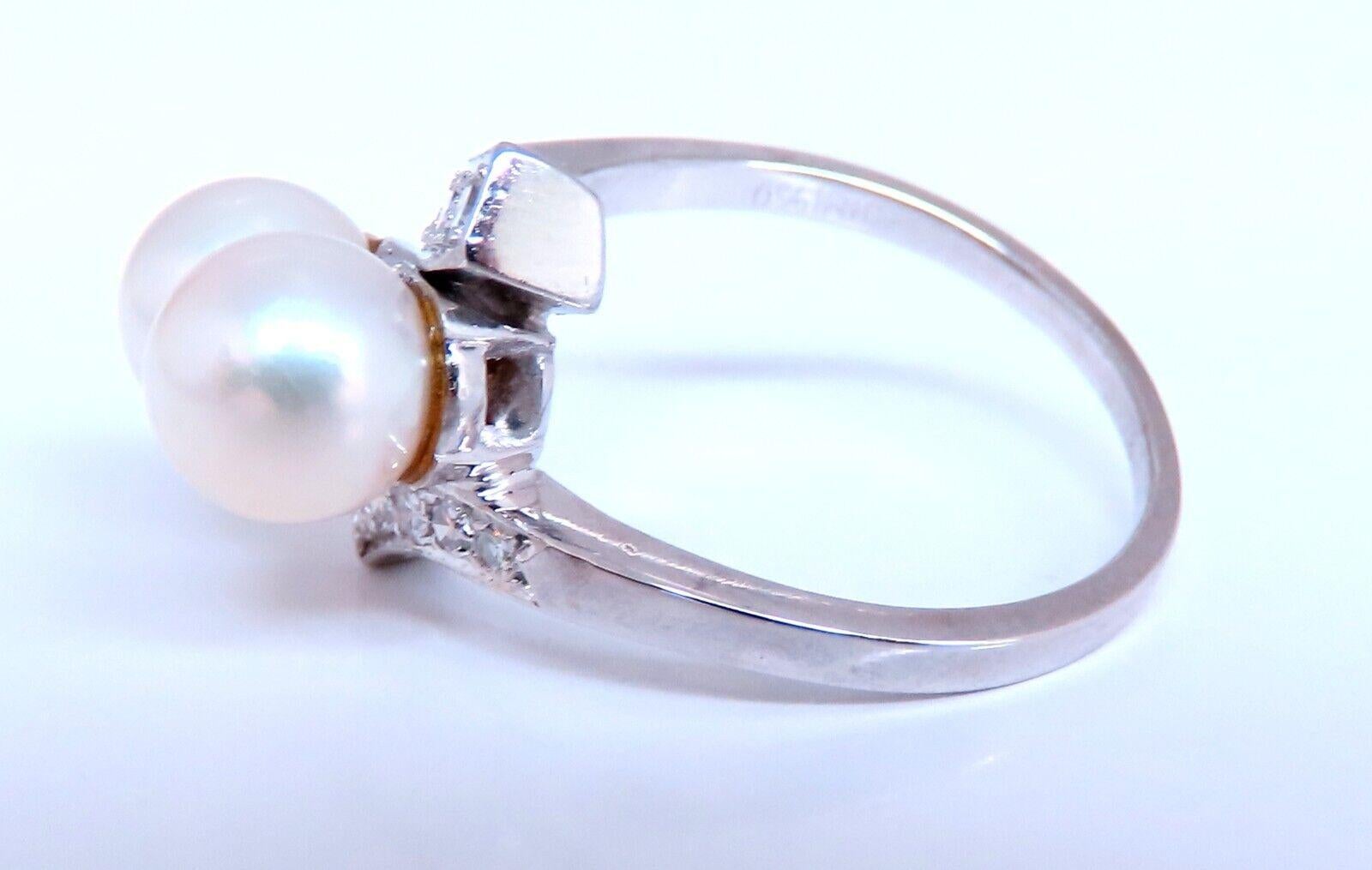 6.5mm Natural Fresh water pearl Gold Ring

.25ct Natural Round Diamonds

14kt. white gold

4.3 grams.

Current ring size: 5.25

We may resize.

Depth of ring: 9.6mm