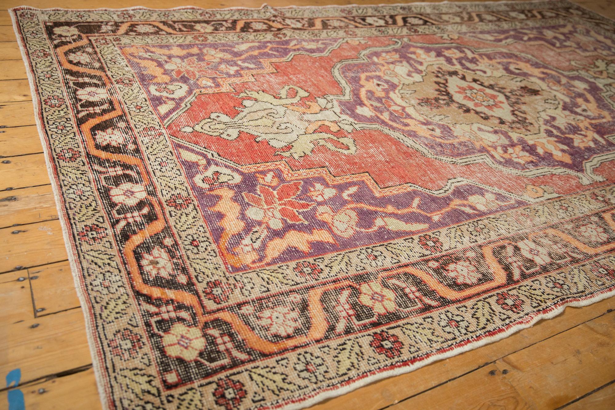 20th Century Vintage Distressed Oushak Carpet For Sale