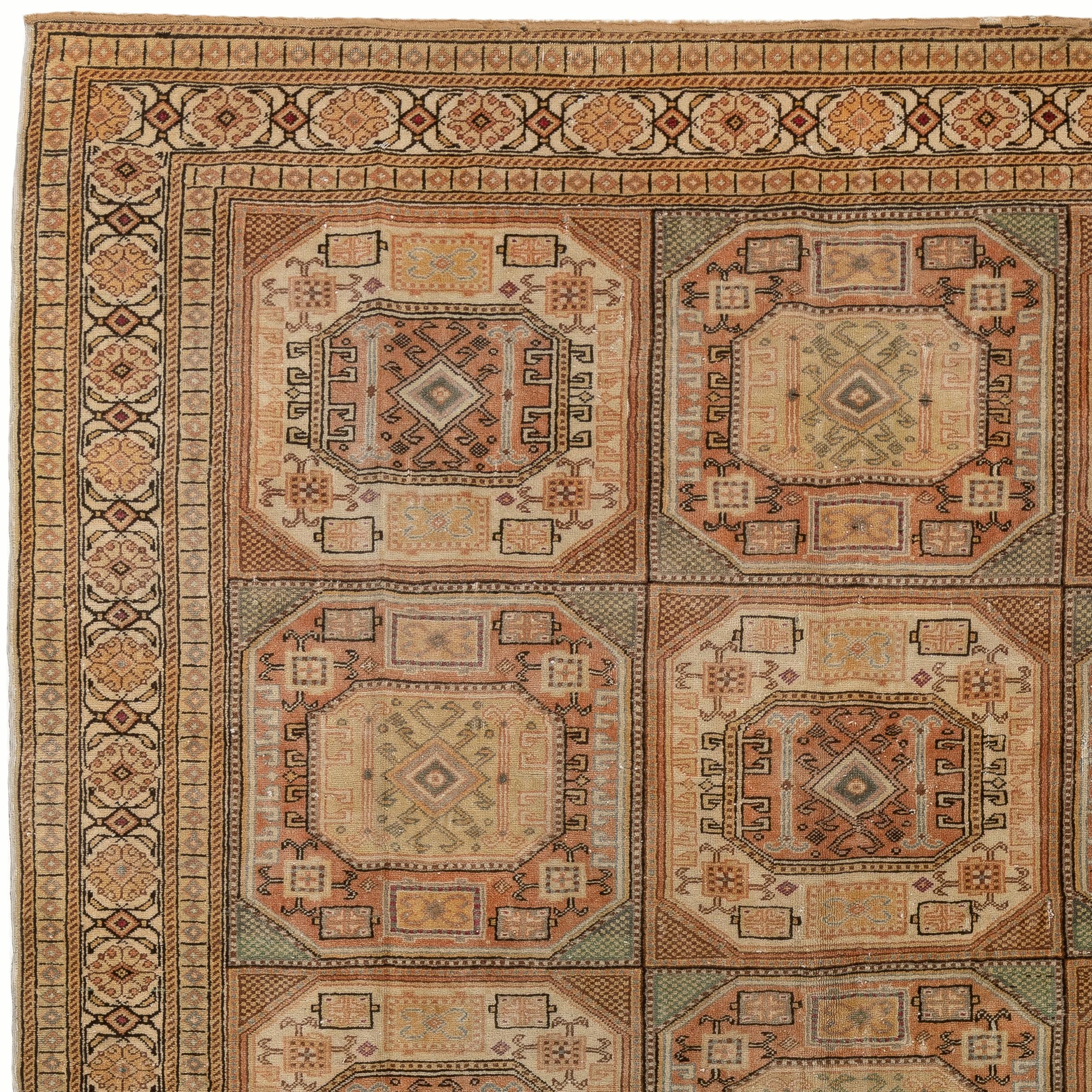 A finely hand knotted rug from the town of Kayseri in Central Anatolia with soft muted colors and well drawn geometric design with tribal patterns. 
Size: 6.6 x 9.4 Ft.
Soft medium wool pile on cotton foundation.
The rug is washed professionally. It