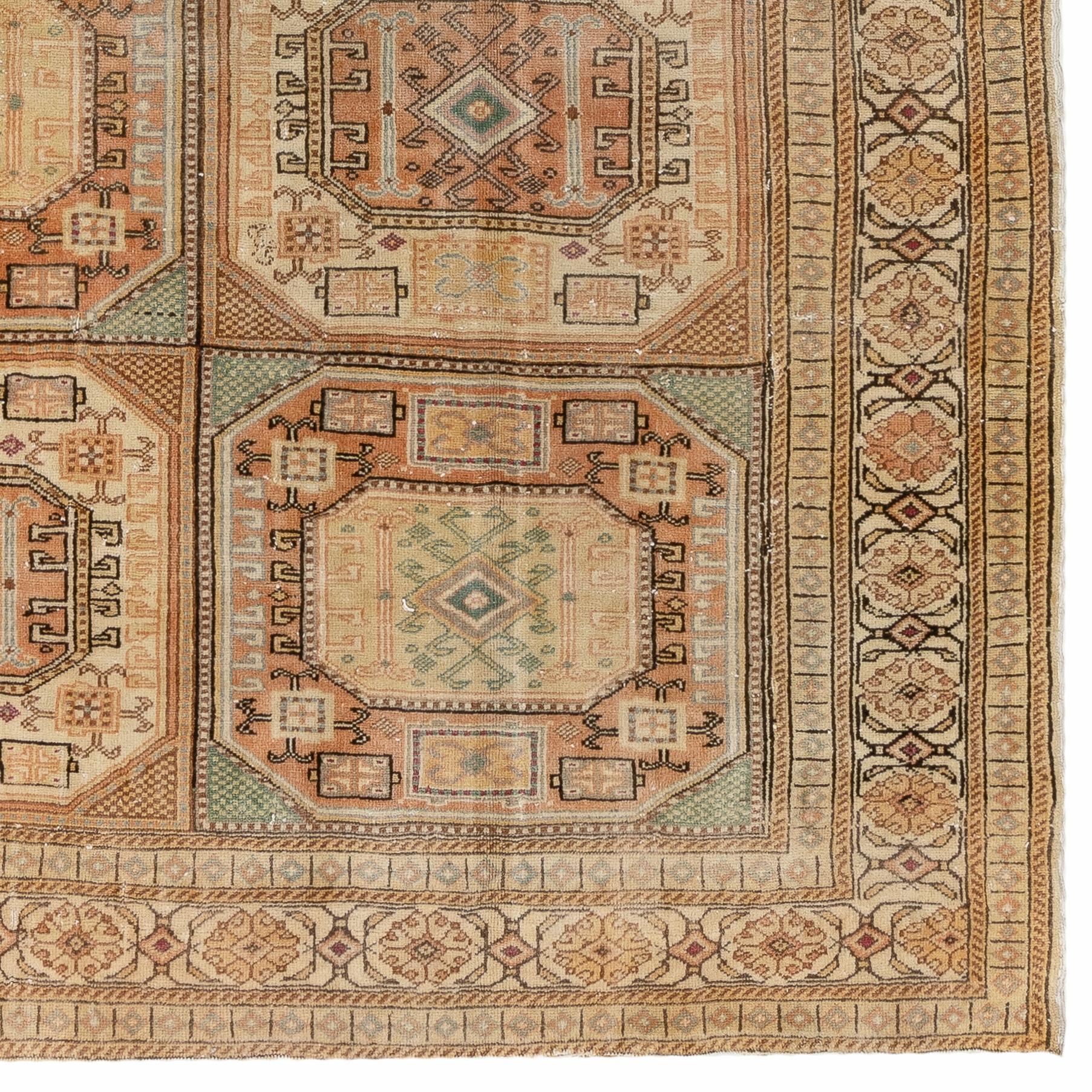 A finely hand knotted rug from the town of Kayseri in Central Anatolia with soft muted colors and well drawn geometric design with tribal patterns. 
Size: 6.6 x 9.4 Ft.
Soft medium wool pile on cotton foundation.
The rug is washed professionally. It