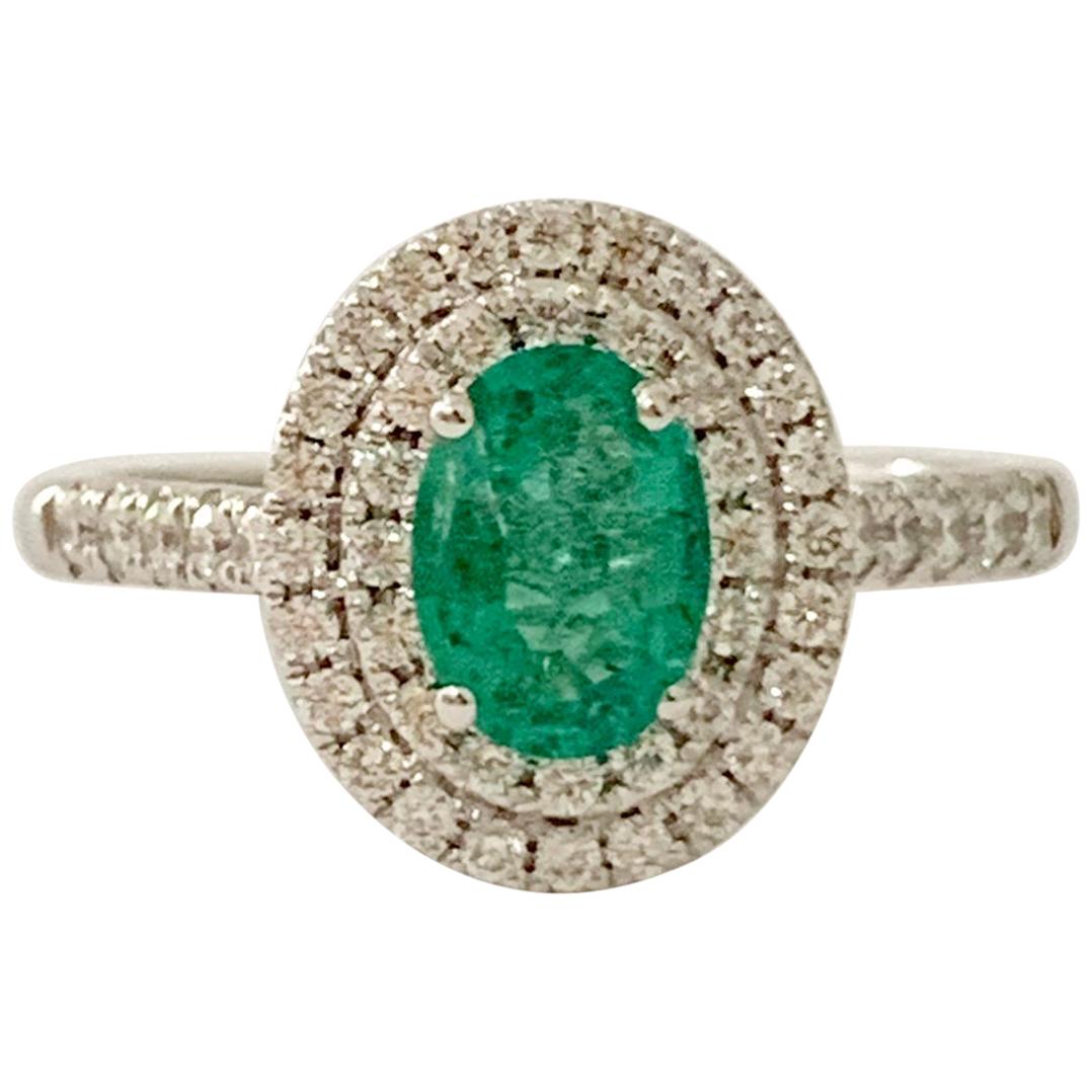 .66 Carat AAAA Oval Emerald Set in Double Diamond Halo Ring in 18ct White Gold For Sale