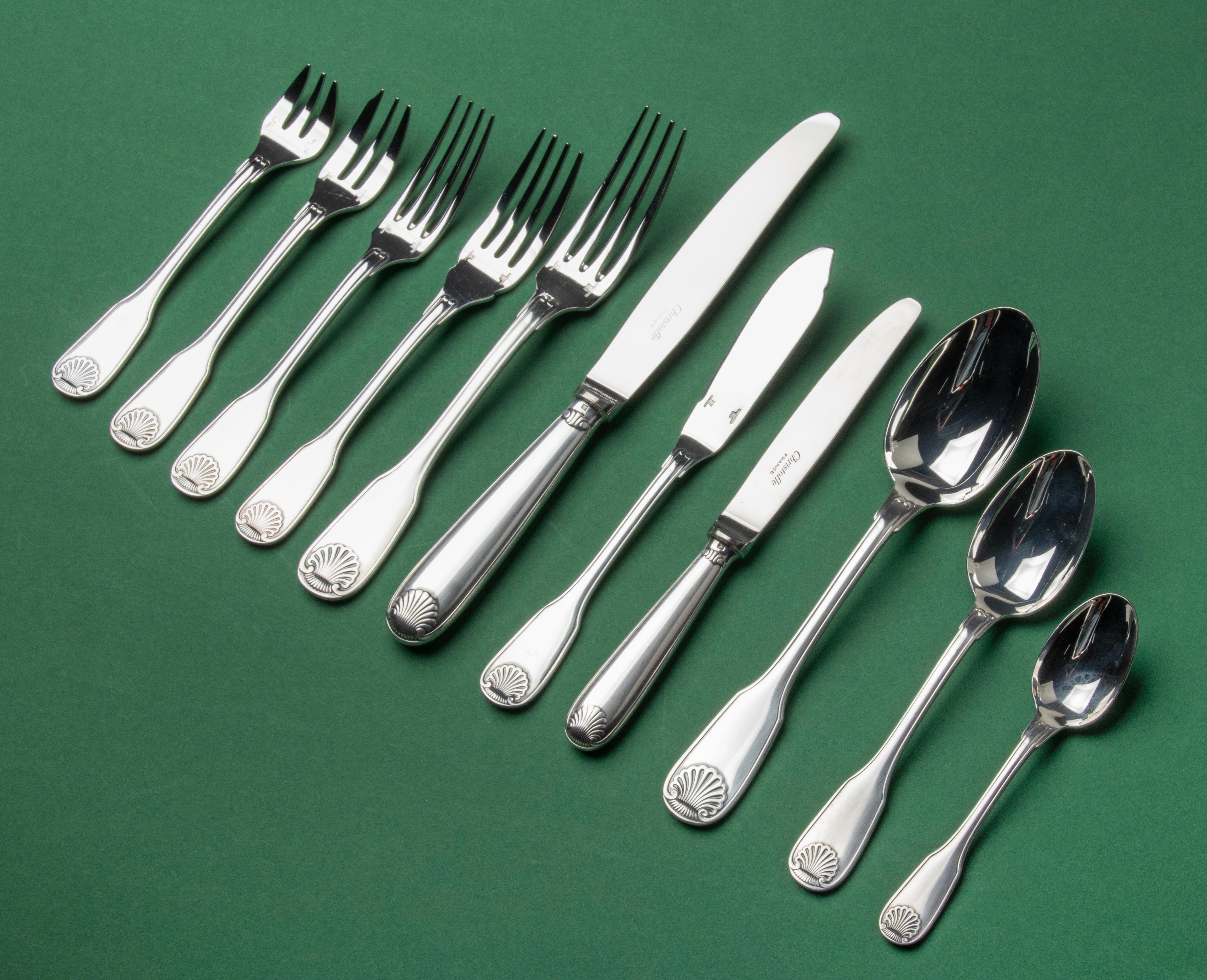 A beautiful set of silver plated tableware made by Christofle France. The name of the model is Vendome Coquille. It is a set for 6 persons. The composition of the set is as follows: 6 table knives, 6 table spoons, 6 table forks, 6 lunch knives, 6