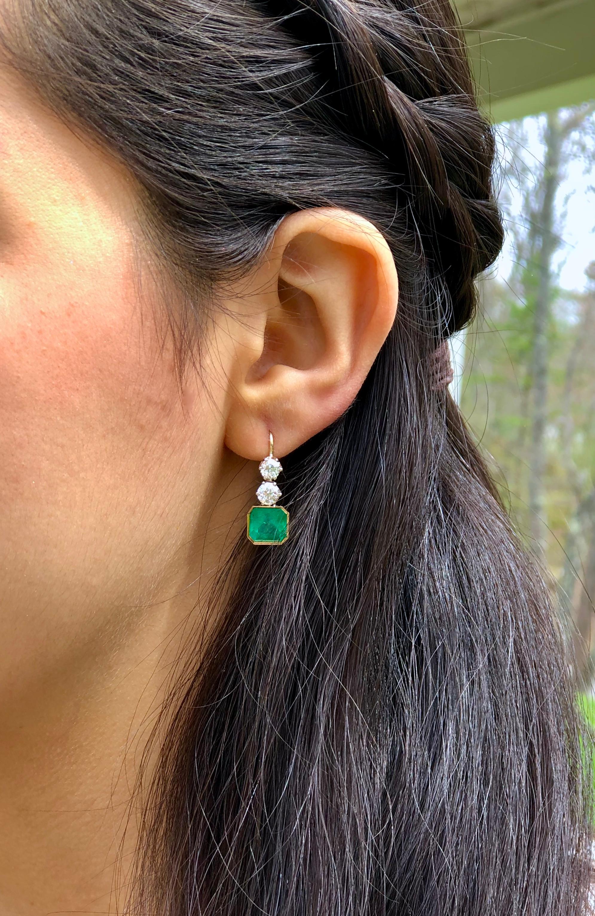 The Gorgeous 5 Carat finest Colombian Emerald Emerald Cut are set in these remarkable 1.60 carat Old European cut diamonds. This exquisite pair of earrings are beautifully crafted with 18K yellow and white gold, feature four old European cut