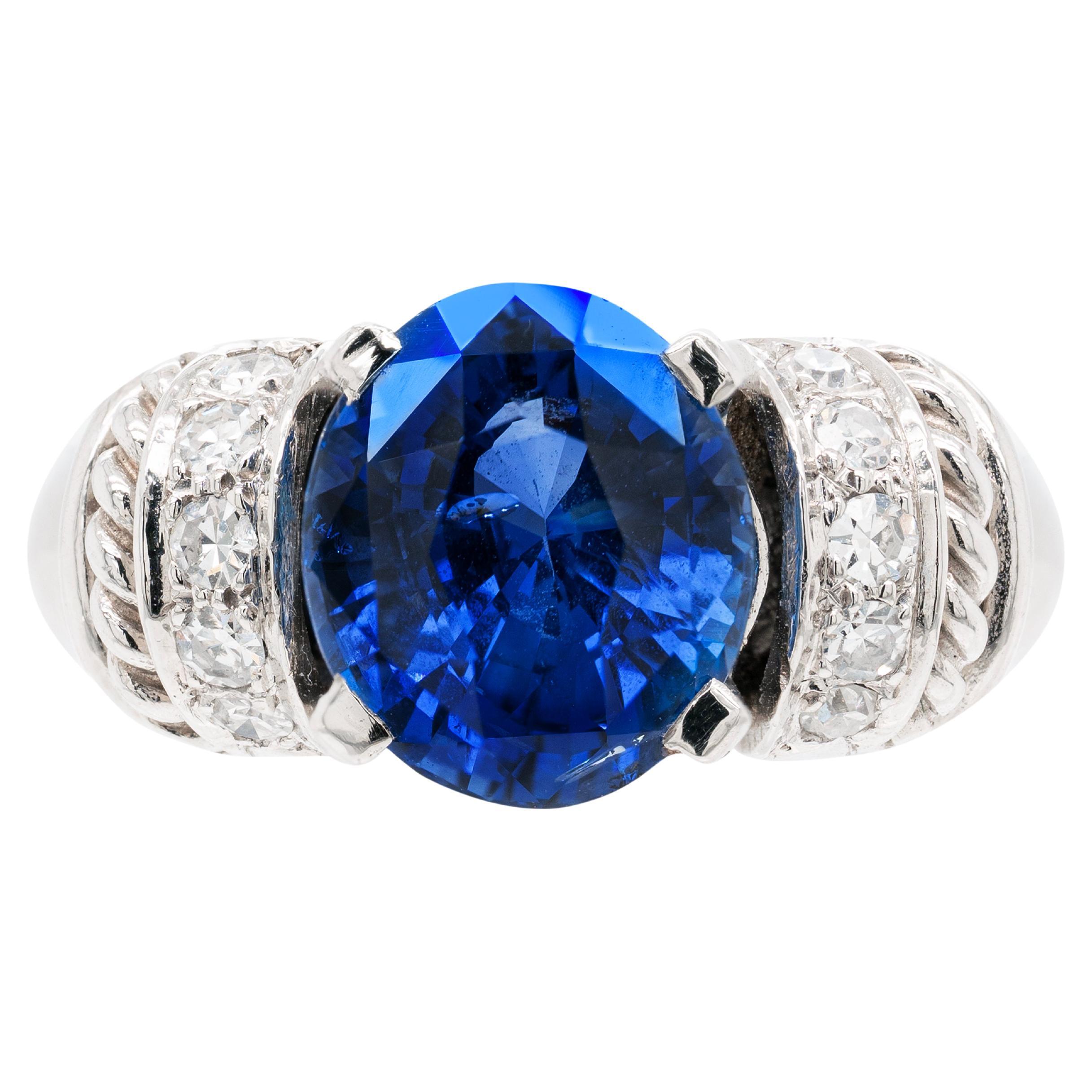 Bague de fiançailles en platine avec saphir bleu ovale de 6,60 carats et diamants