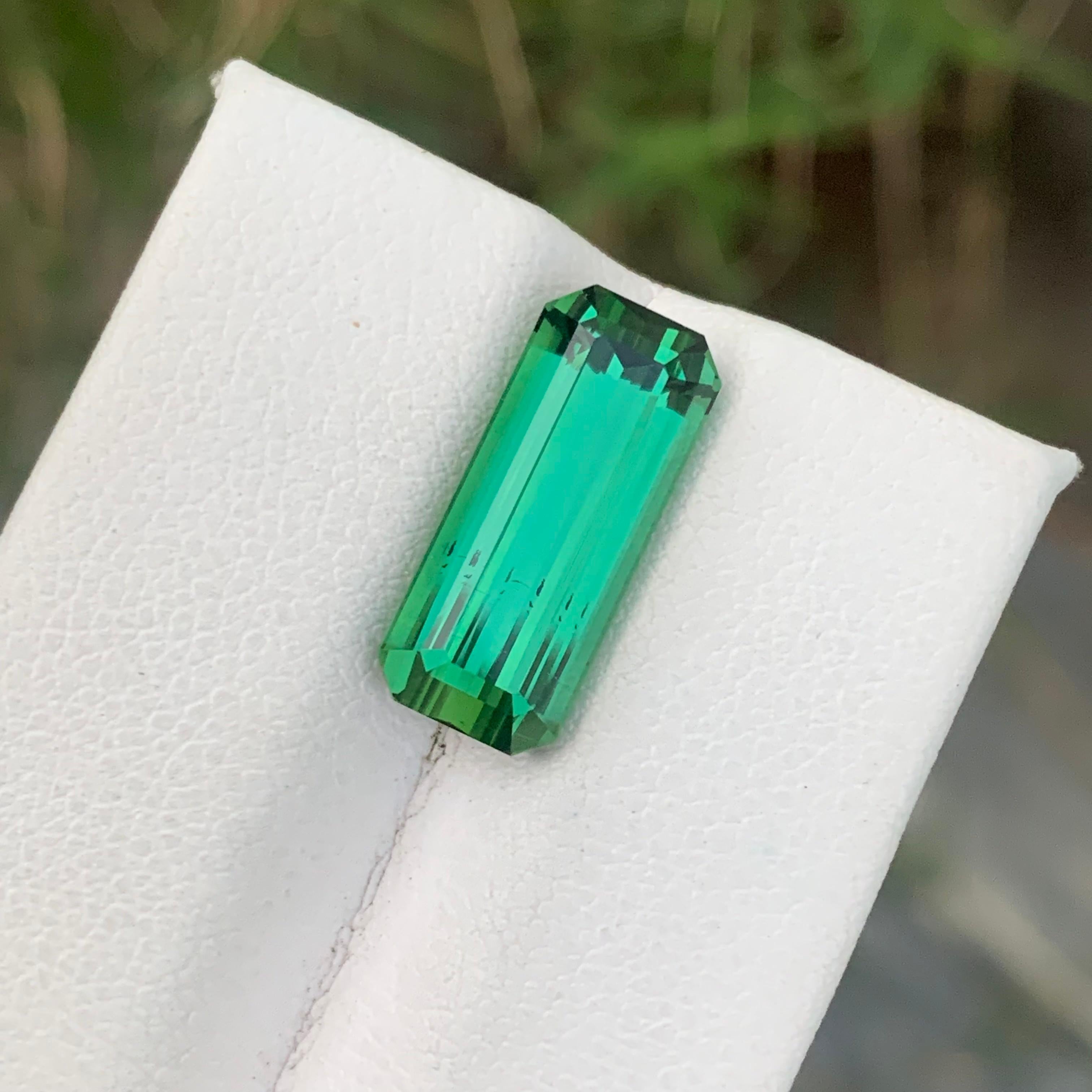 Faceted Green Tourmaline 
Weight: 6.60 Carat
Dimension: 16.6x7.1x6.3 Mm
Origin: Kunar Afghanistan 
Shape: Emerald 
Color: Bright Green 
Quality: SI / Eye Clean 
Certificate: On Demand 
Heated/Treatment: None
.
Bright green tourmaline, also known as