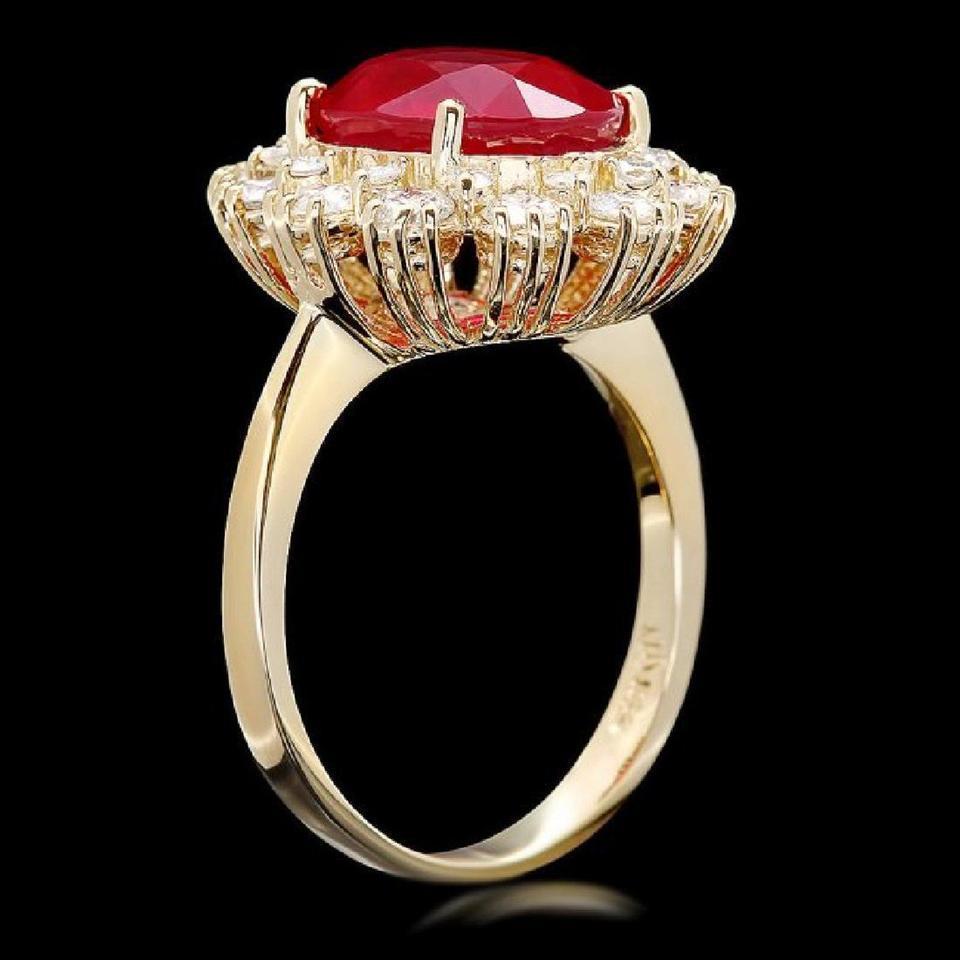 6.60 Carats Impressive Natural Red Ruby and Diamond 14K Yellow Gold Ring

Total Red Ruby Weight is: Approx. 5.40 Carats (Lead Glass Filled)

Ruby Measures: Approx. 11.00 x 9.00mm

Natural Round Diamonds Weight: Approx. 1.20 Carats (color G-H /