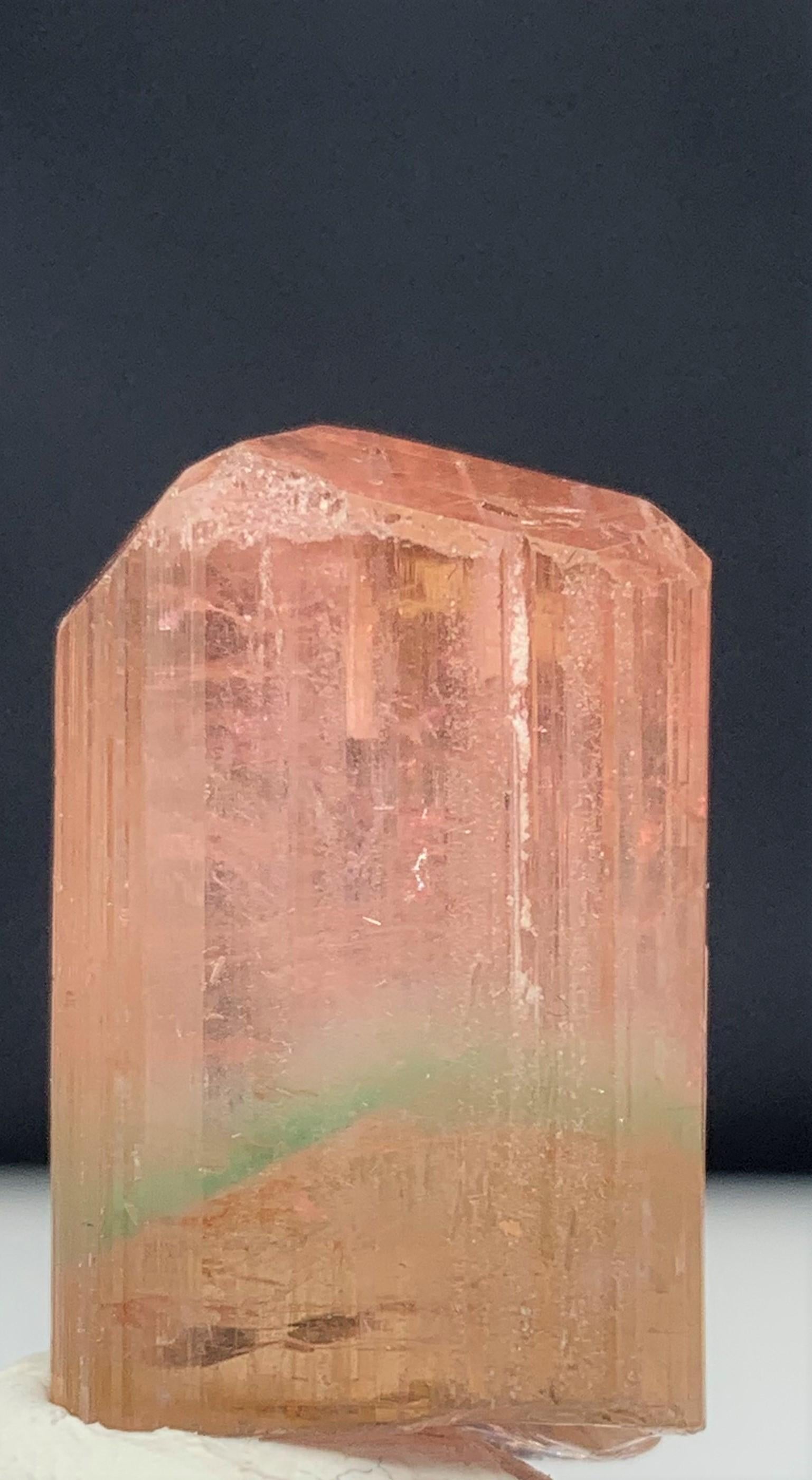 Attractive Bi-Color Tourmaline Crystal From Afghanistan
WEIGHT: 66.10 Carat
DIMENSIONS: 2.7 x 1.7 x 1.3 Cm
ORIGIN: Afghanistan
COLOR : Peach And Green
TREATMENT: None

Tourmaline is an extremely popular gemstone; the name Tourmaline is