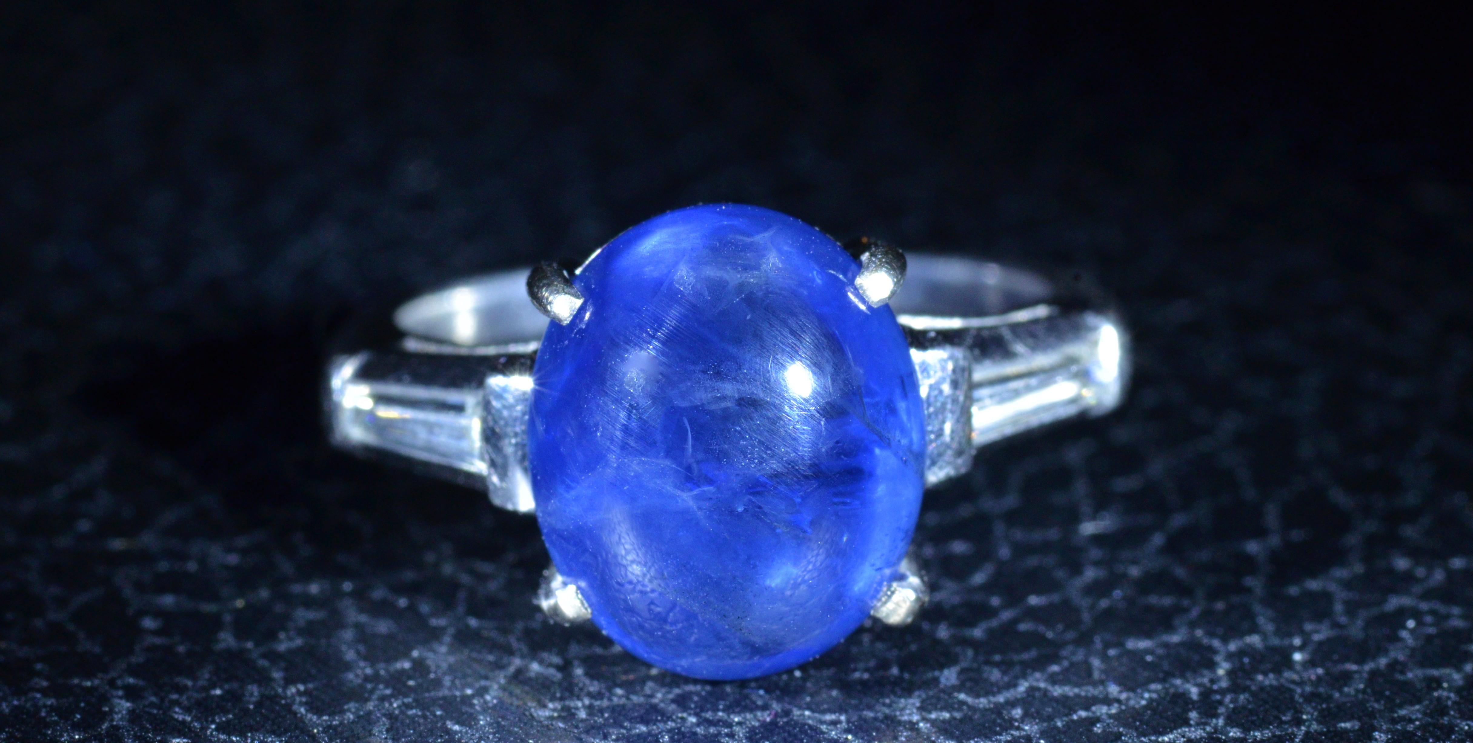 Art Deco 6.62 Carat Cabochon Sapphire Ring in Platinum Set with Baguette Cut Diamonds For Sale