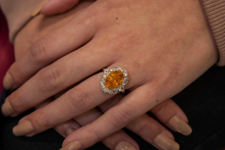 6.64 Carat Oval Cut Orange Sapphire and Diamond Halo Engagement Ring For Sale 1