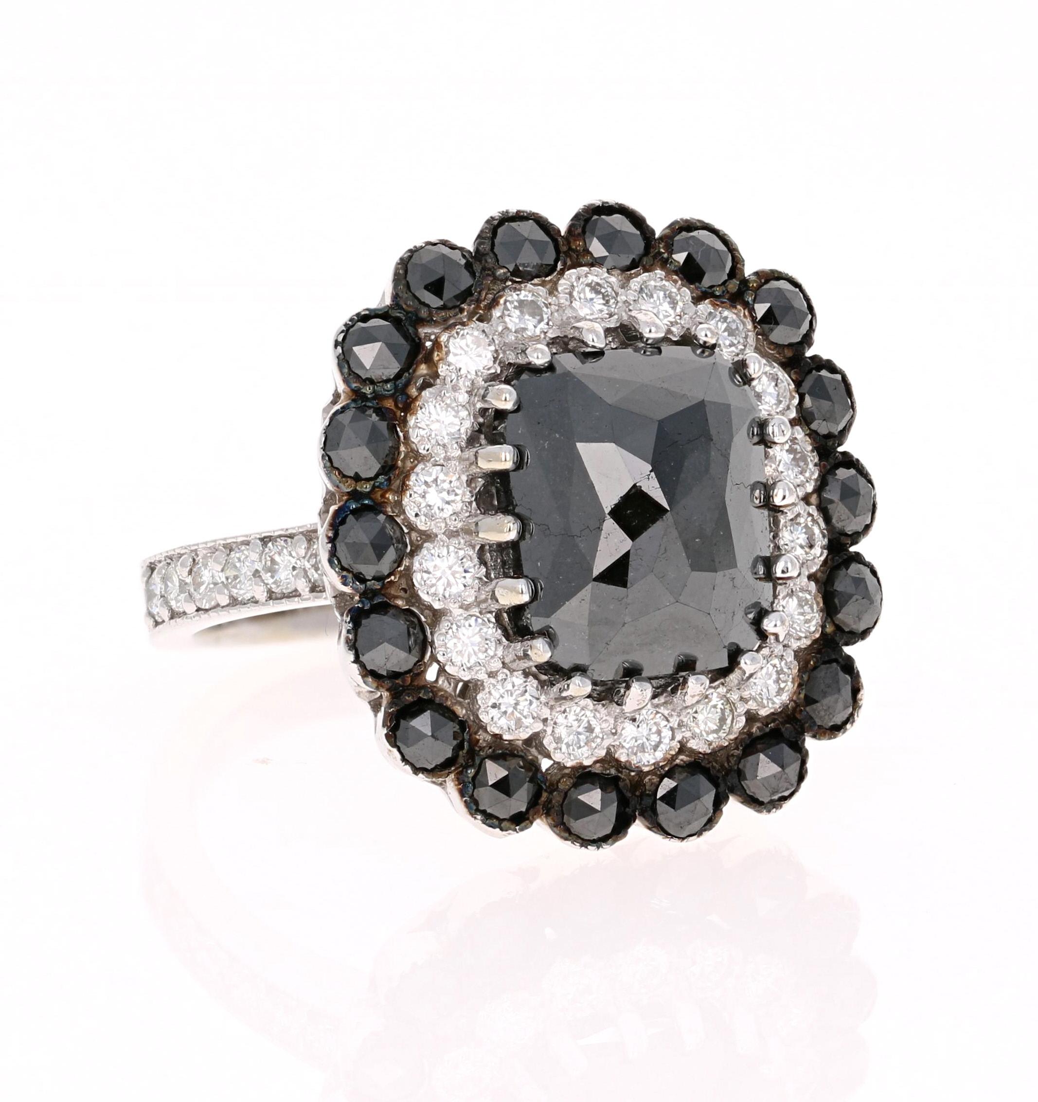 BOLD AND BEAUTIFUL!! 
6.65 Carat Black Diamond White Gold Bridal or Engagement Ring  

A 4.79 Carat Rectangular Cushion Cut Black Diamond sits in the center and is surrounded by both Black and White Round Cut Diamonds. The carat weight of the black