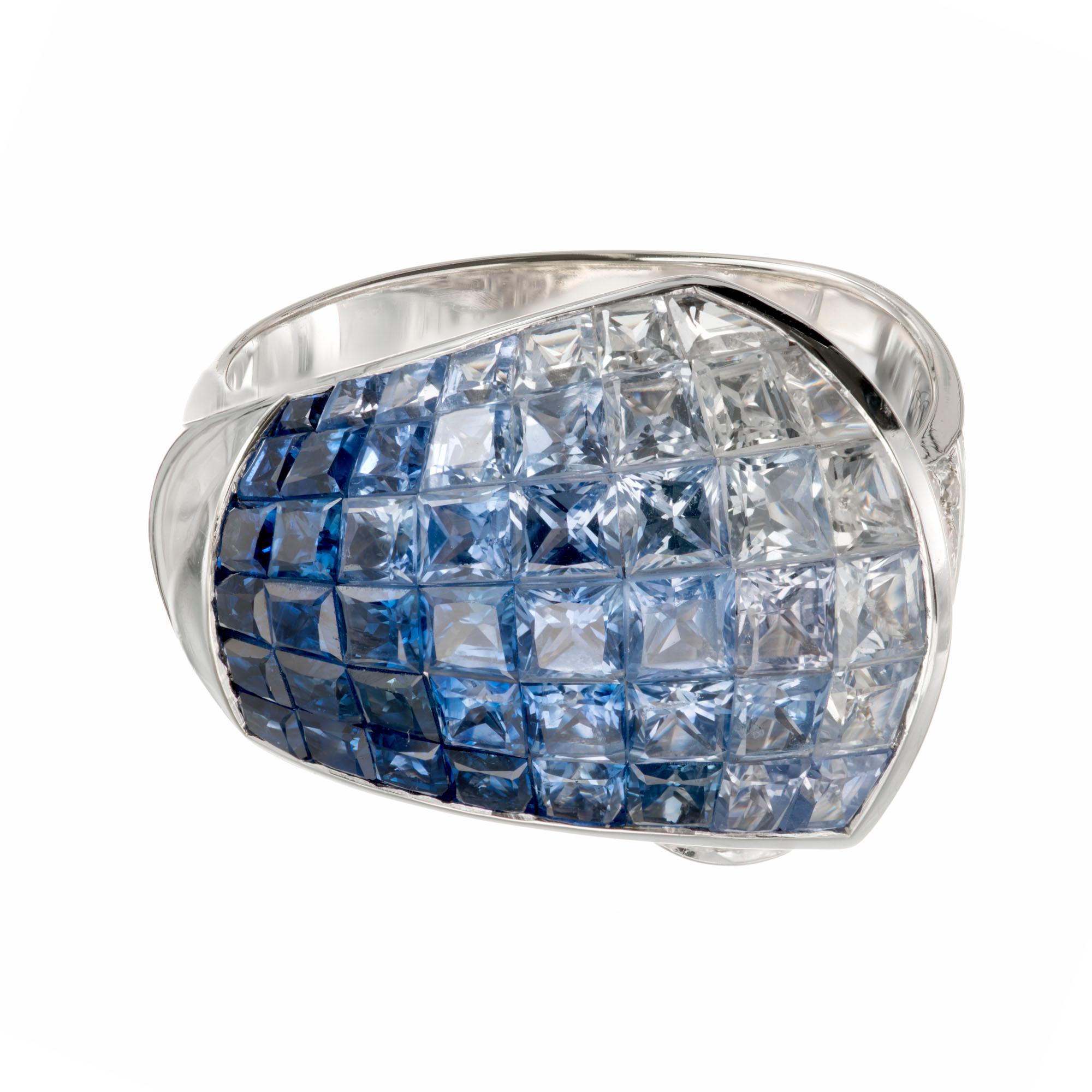 Sapphire and diamond white gold cocktail ring. Blue and white invisibly set, sapphires with white full cut diamonds. Sapphires are blended blue to white. Contrasted by full cut white brilliant diamonds. 

47 genuine invisible set custom cut