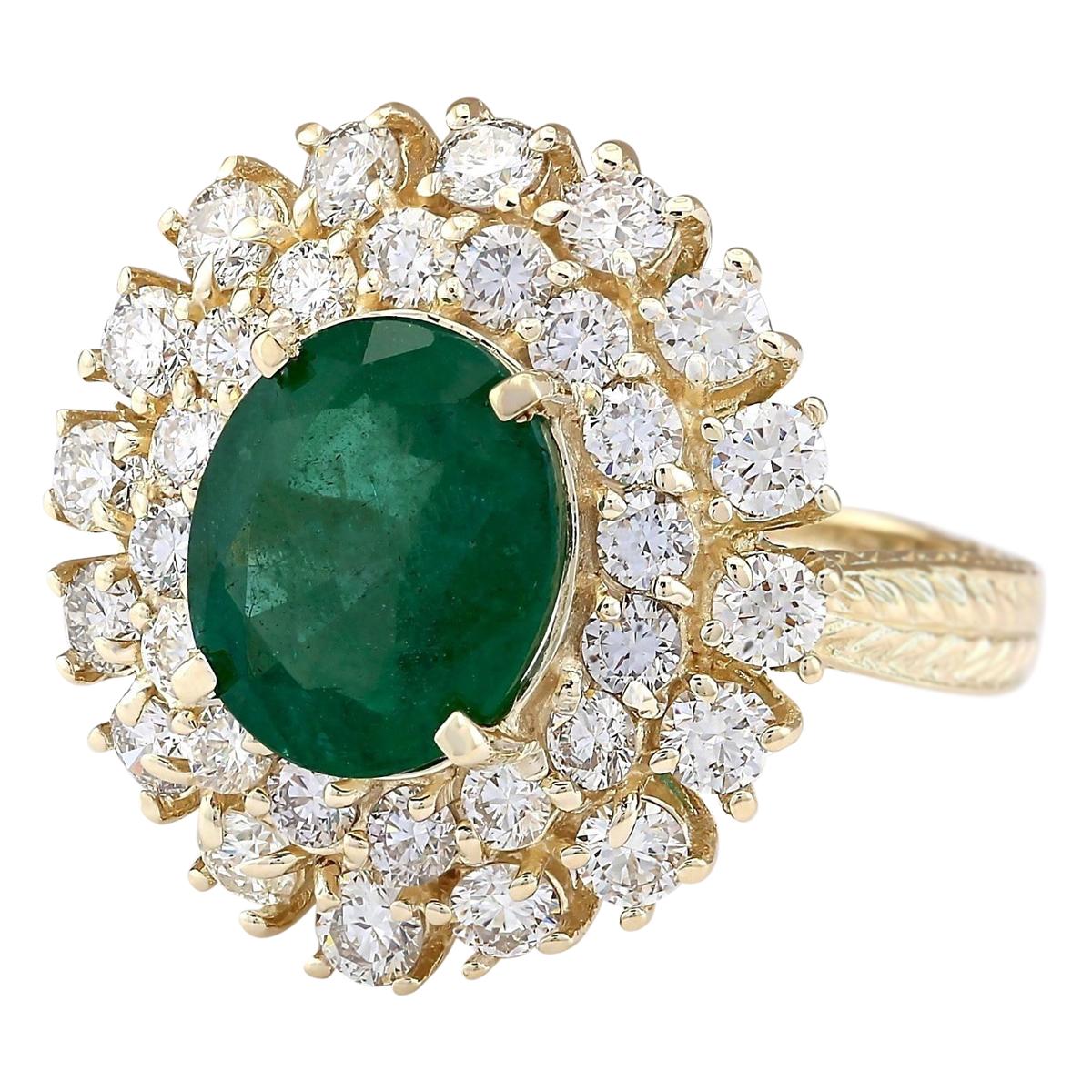 Presenting our exquisite 6.65 Carat Emerald 14 Karat Yellow Gold Diamond Ring.

Stamped with authenticity, this ring boasts 14K Yellow Gold and weighs a total of 9.0 grams.

At its center shines a magnificent emerald, weighing 4.30 carats and