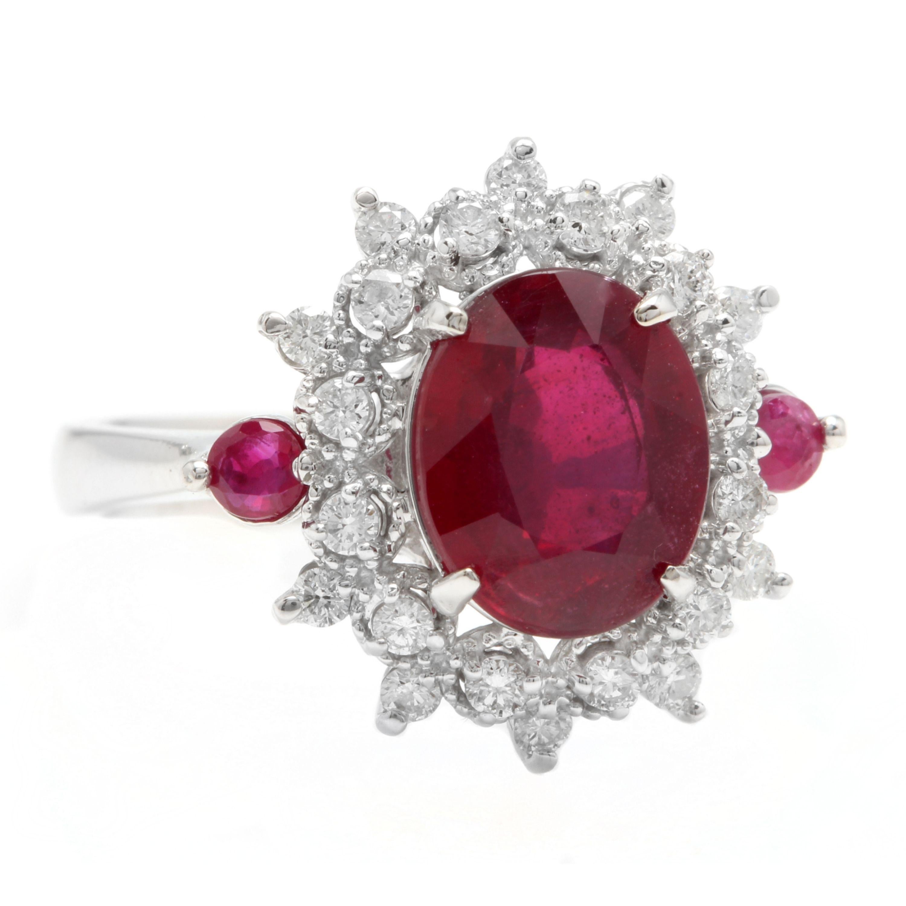 6.65 Carats Impressive Red Ruby and Diamond 14K White Gold Ring

Total Red Ruby Weight is Approx. 6.00 Carats (lead glass-filled)

Ruby Measures: 11 x 9mm

Natural Round Diamonds Weight: Approx. 0.65 Carats (color G-H / Clarity SI1-SI2)

Ring size: