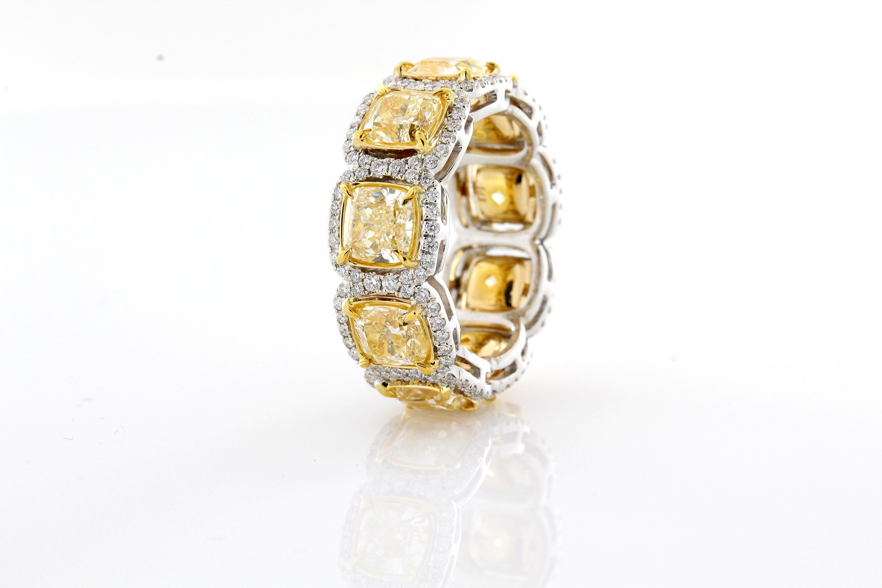 Incredible Deal on 6.66 Carat Total Weight Cushion Cut, Natural Fancy Yellow Color VS Clarity Diamond Eternity Halo Style Ring.
Total Carat Weight on the ring is 7.46

This Classic mounting is fashioned from 18 Karat White and Yellow Gold. 
There