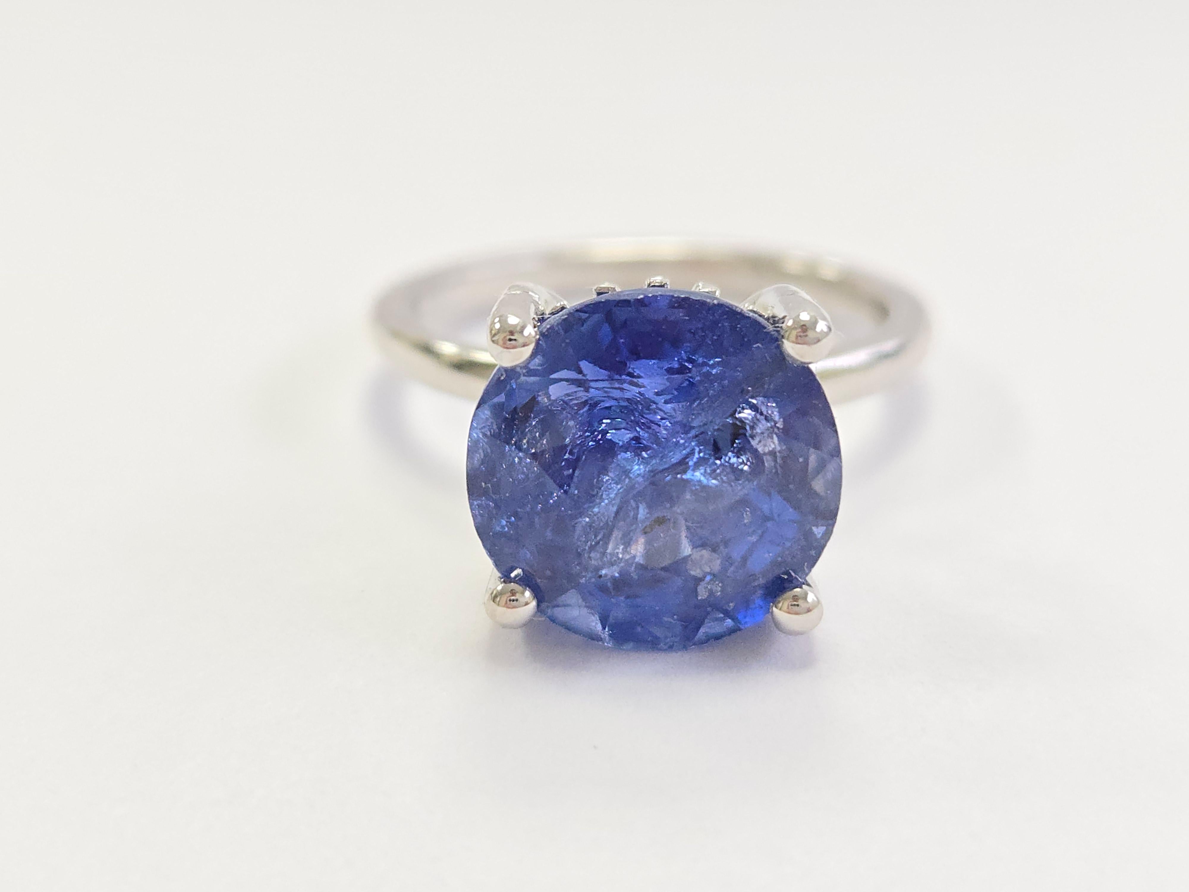 Exquisite 6.66 Carat Round Shape Natural Sapphire Ring in 14K White Gold

Indulge in the brilliance of this remarkable natural sapphire ring, featuring a stunning 6.66-carat round sapphire set in a luxurious 14K white gold band. The vibrant blue