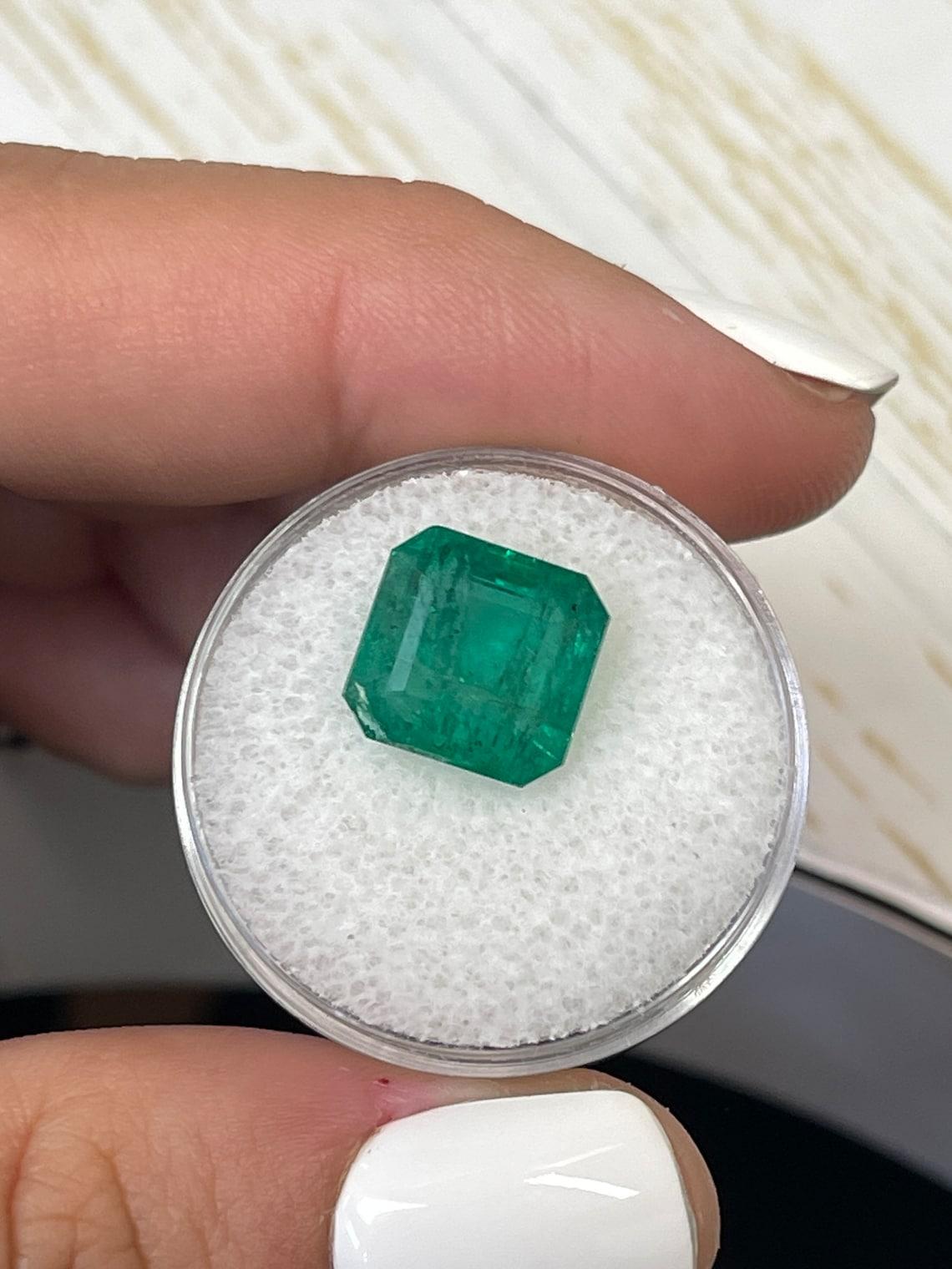 Stone: Emerald
Weight: 6.68-carats
Shape: Emerald Cut
Clarity: Transparent
Luster: Very Good
Color: Medium Green
Measurements: 10.60mm x 10.25mm x 7.19mm
Geographic Origin: Zambia
Treatment: Natural, Oiling

Comments: Due to their growth conditions
