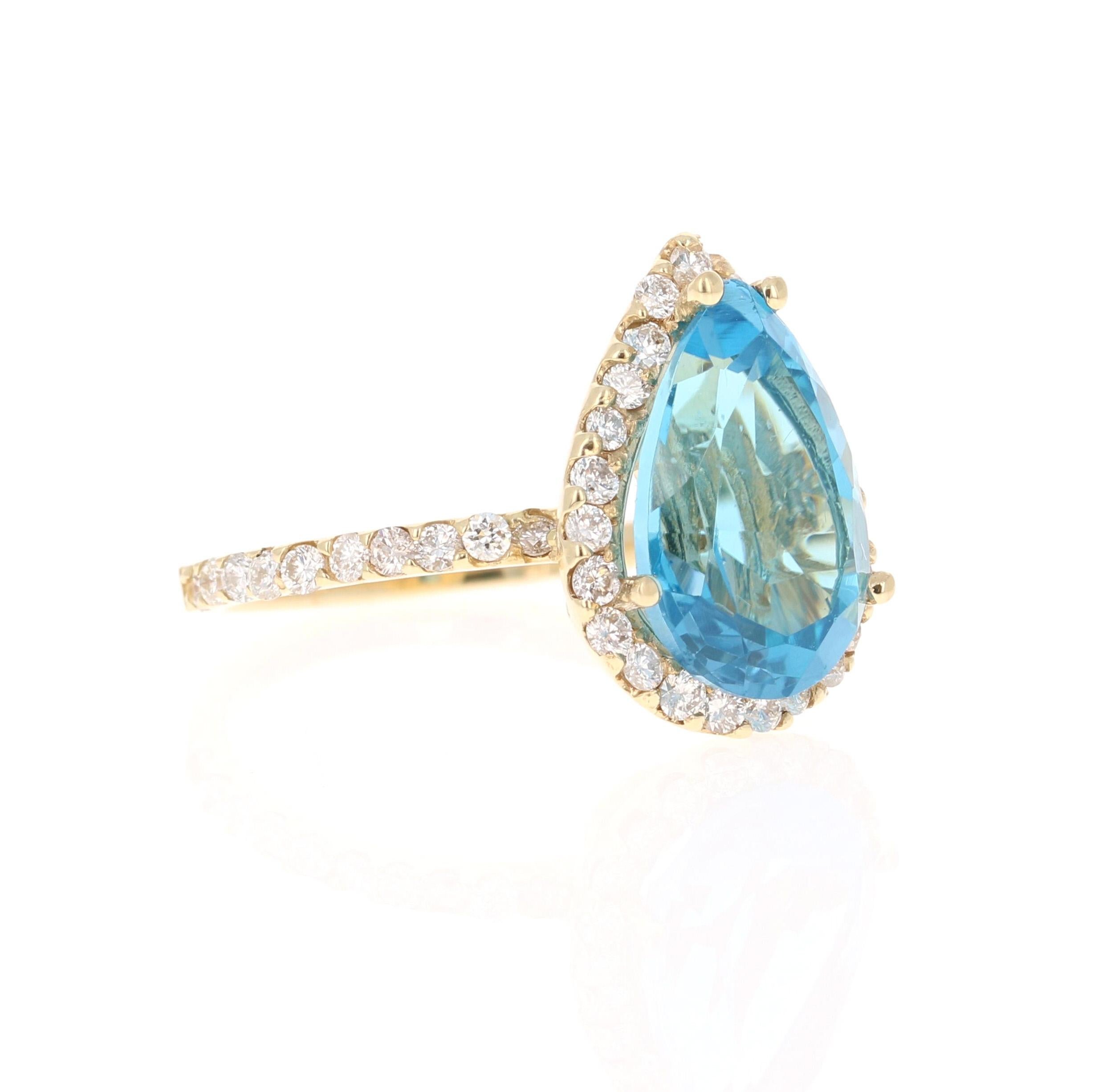 This ring has a beautiful Pear Cut Blue Topaz that weighs 5.84 carats. It also has 45 Round Cut Diamonds that weigh 0.84 carats. The total carat weight of the ring is 6.68 carats. The clarity and color of the diamonds are SI-F. 

The ring is set in