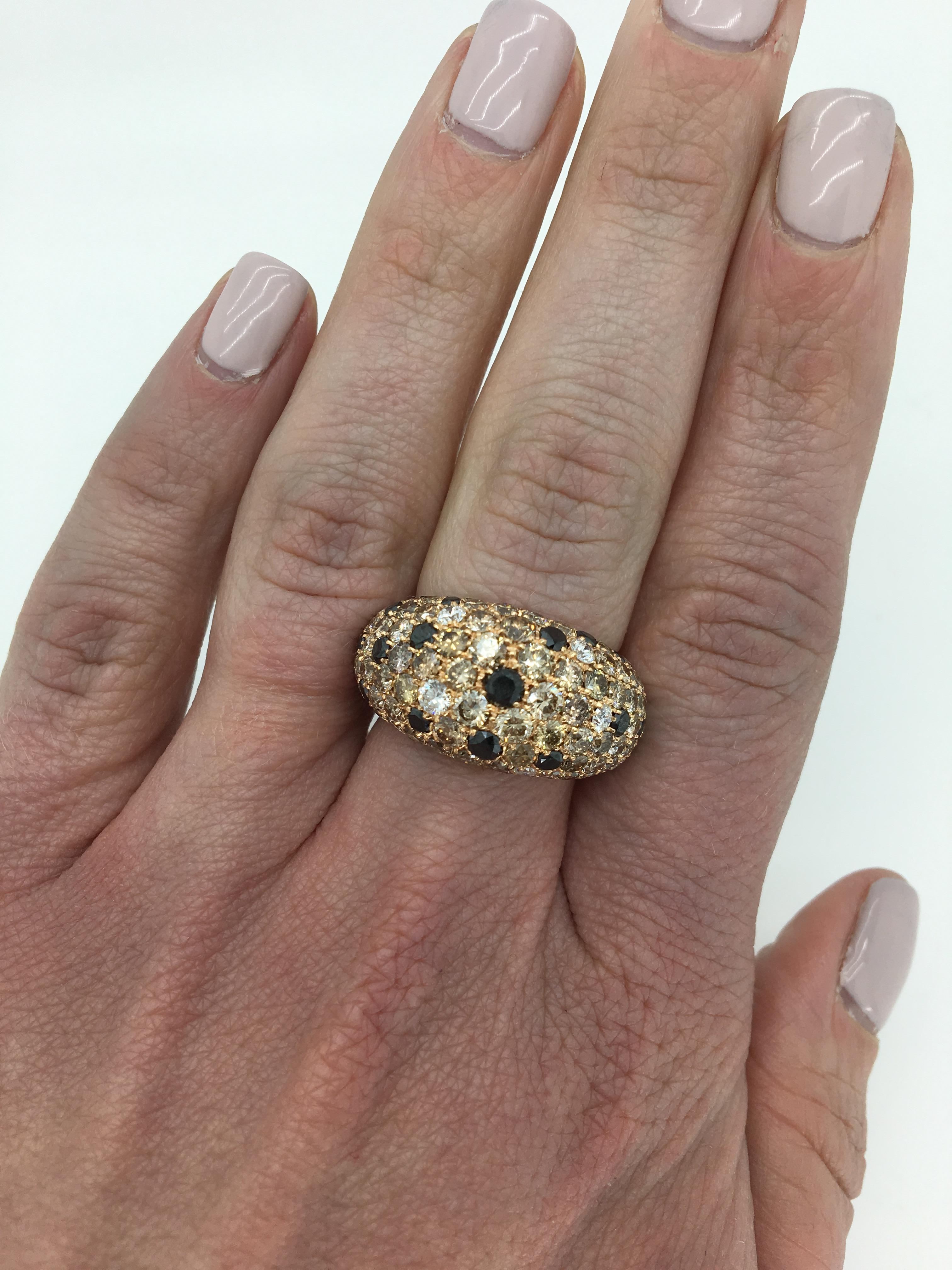 This dome style ring features approximately 6.68 carats of diamonds with a unique color variance cast in 18k rose gold.

Total Approximate Diamond Carat Weight: Approximately 6.68ctw
Diamond Cut: Round Brilliant
Color: Approximately .49CTW with