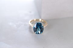 6.68 Carat London Blue Topaz and 0.14 Carat Diamond 14 Karat Yellow Gold Ring