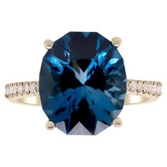 6.68 Carat London Blue Topaz and 0.14 Carat Diamond 14 Karat Yellow Gold Ring