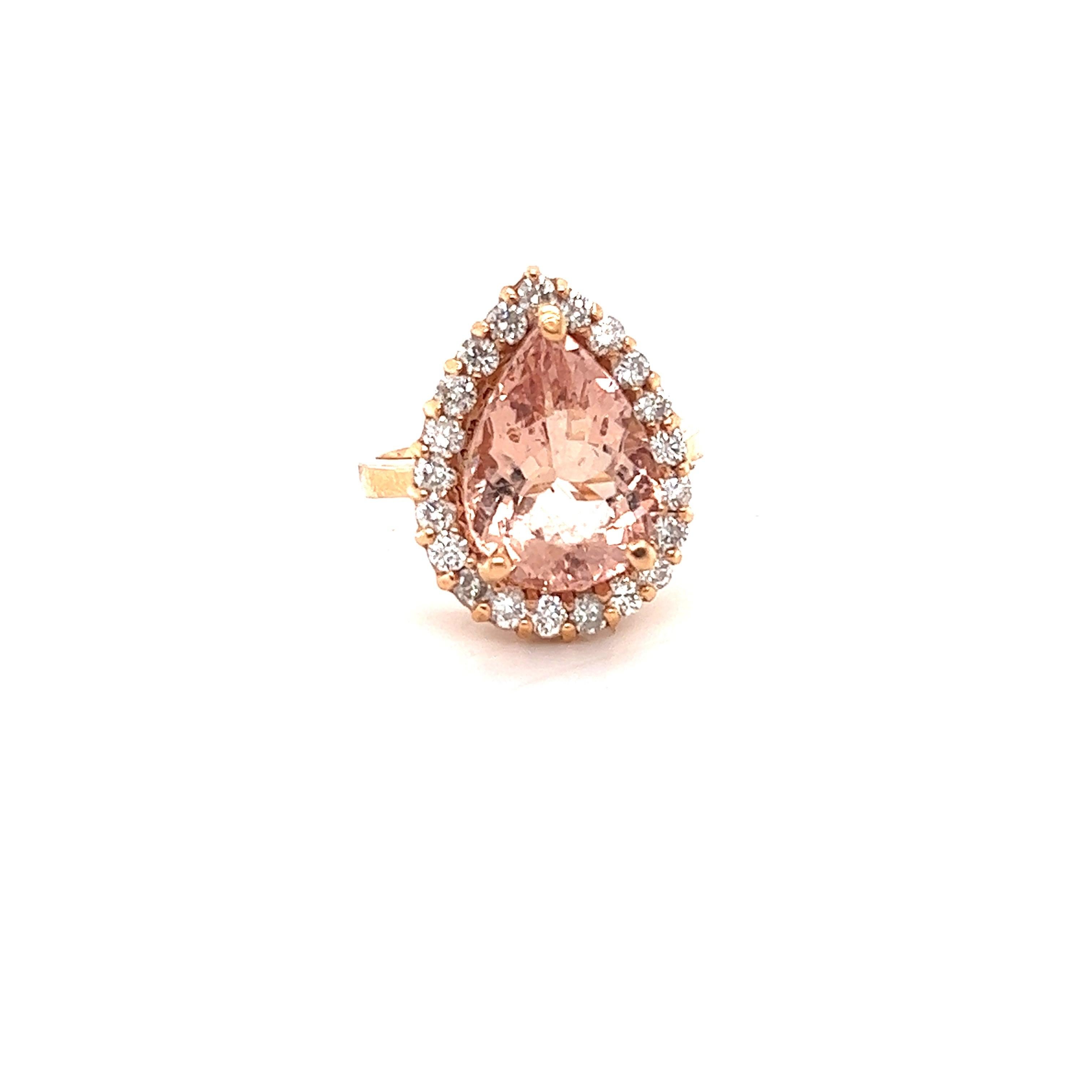 
This Morganite ring has a gorgeous 5.71 Carat Pear Cut Pink Morganite and is surrounded by a halo of 21 Round Cut Diamonds that weigh 0.97 Carats.  The diamonds have a clarity and color of SI-F. The total carat weight of the ring is 6.68 Carats.