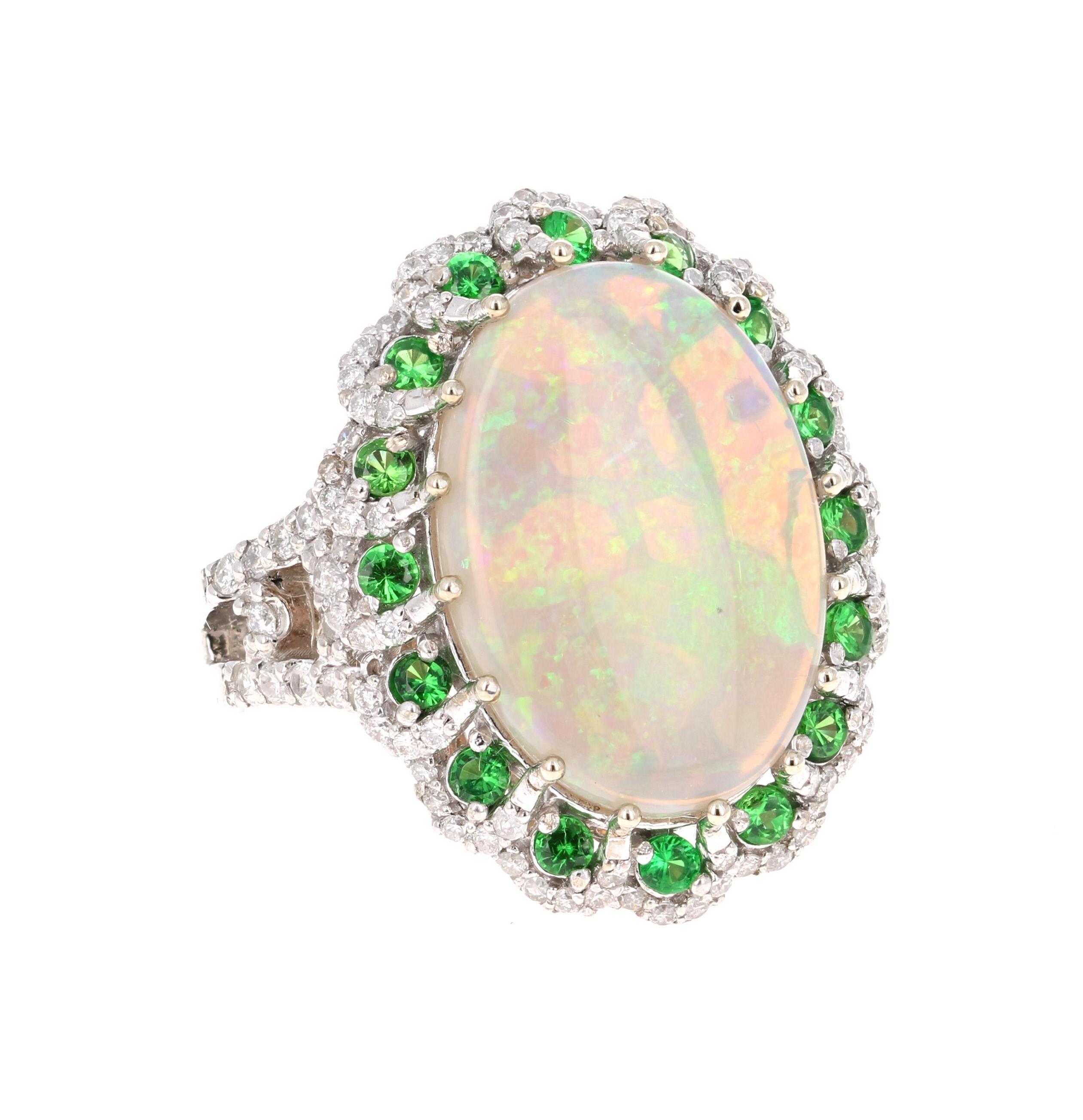 Stunning and uniquely designed 6.68 Carat Oval Cut Opal Diamond White Gold Ring with Tsavorite accents!

The Oval Cut Opal in the center of the ring weighs 5.37 carats.  It is surrounded by accents of 16 Round Cut Tsavorites that weigh 0.62 carats. 