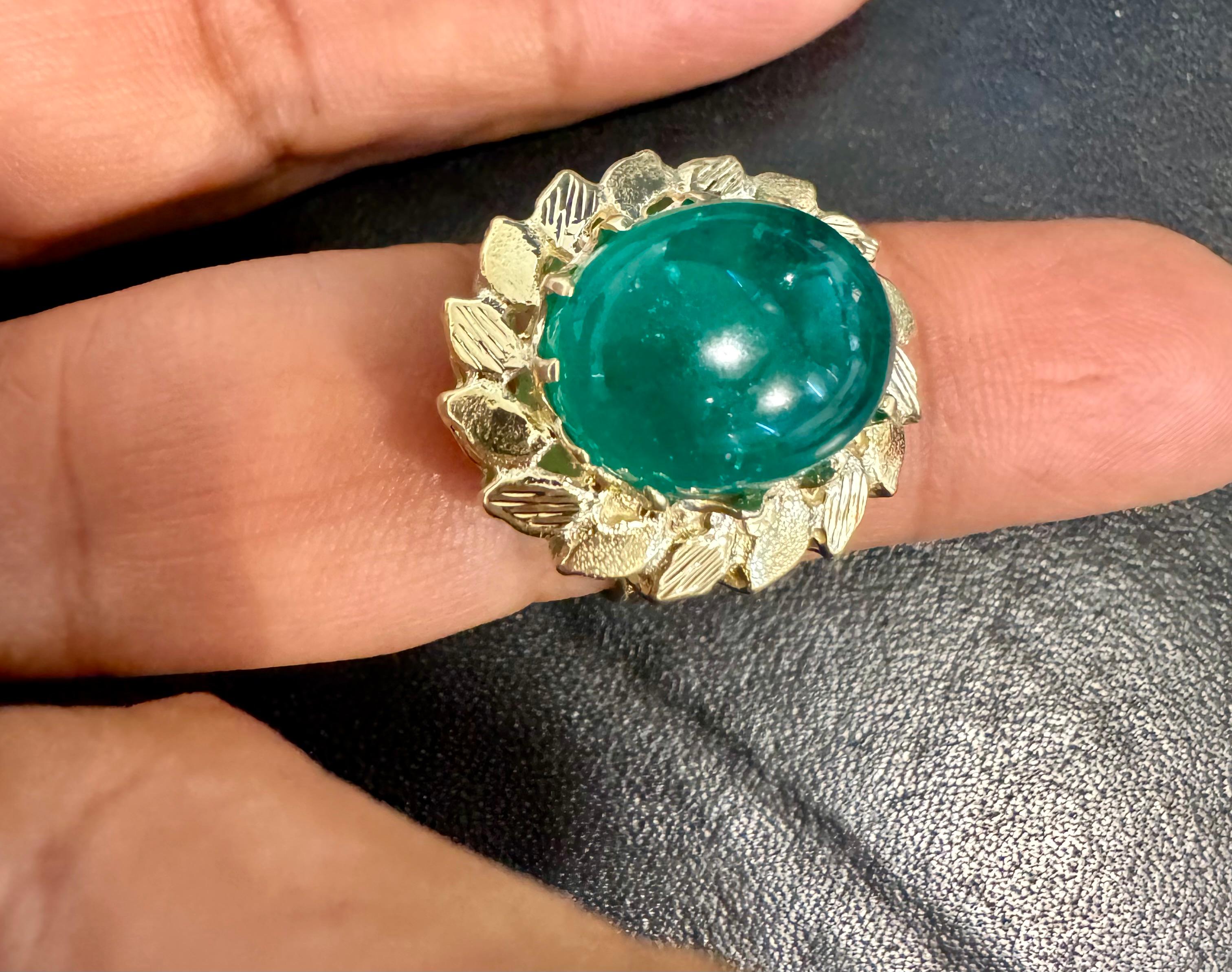 A classic, Cocktail ring 
6.68 Carat Oval Zambian Emerald Cabochon  Cocktail  Ring 14 Karat Yellow Gold , Estate with no color enhancement. 
Gold: 14 Karat  Yellow  gold ,
Weight: 6.9 gram with stone 

Very solid heavy ring 

Emerald: 6.68 Carat