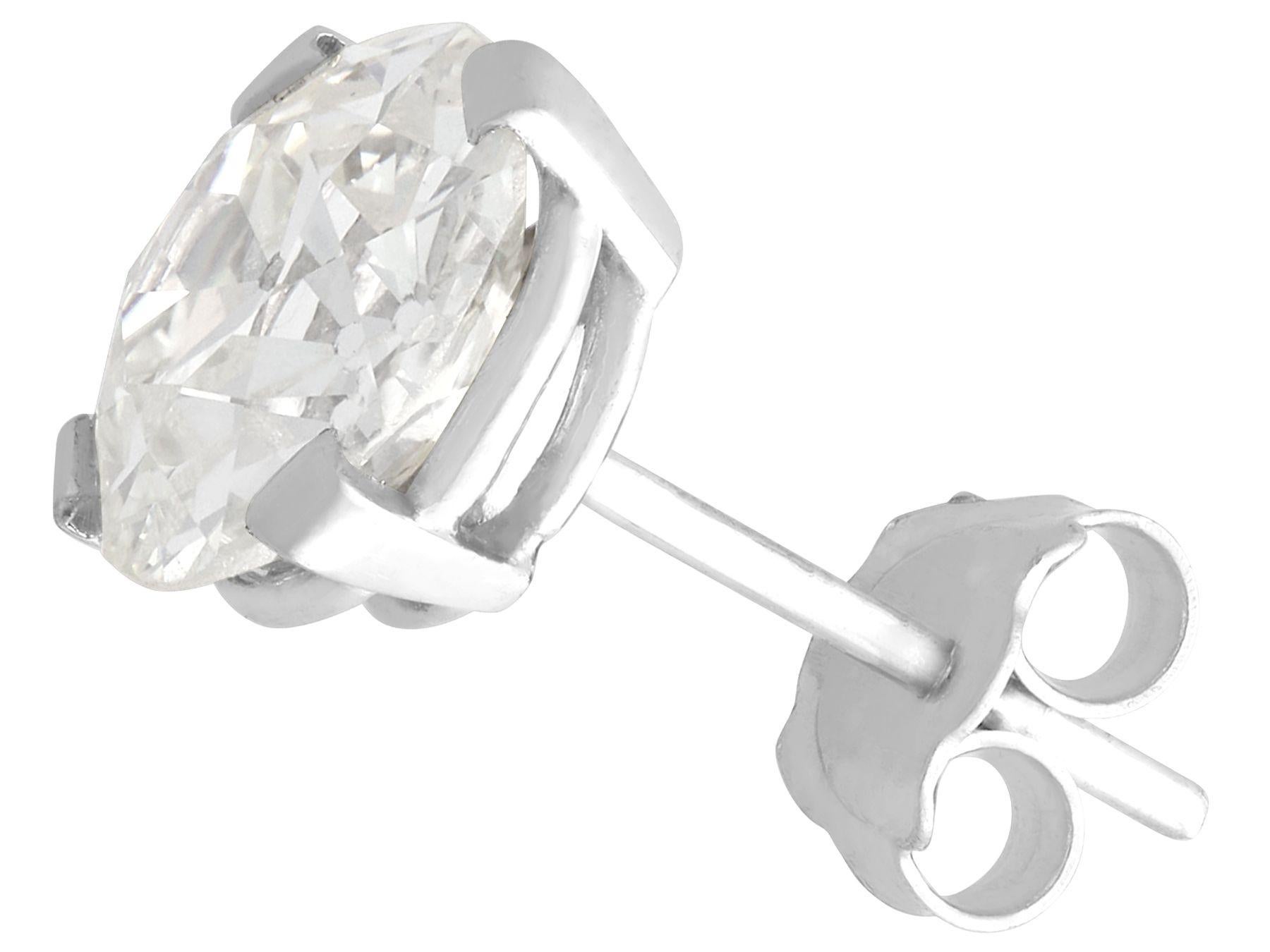 Round Cut 6.69 Carat Diamond and Platinum Stud Earrings