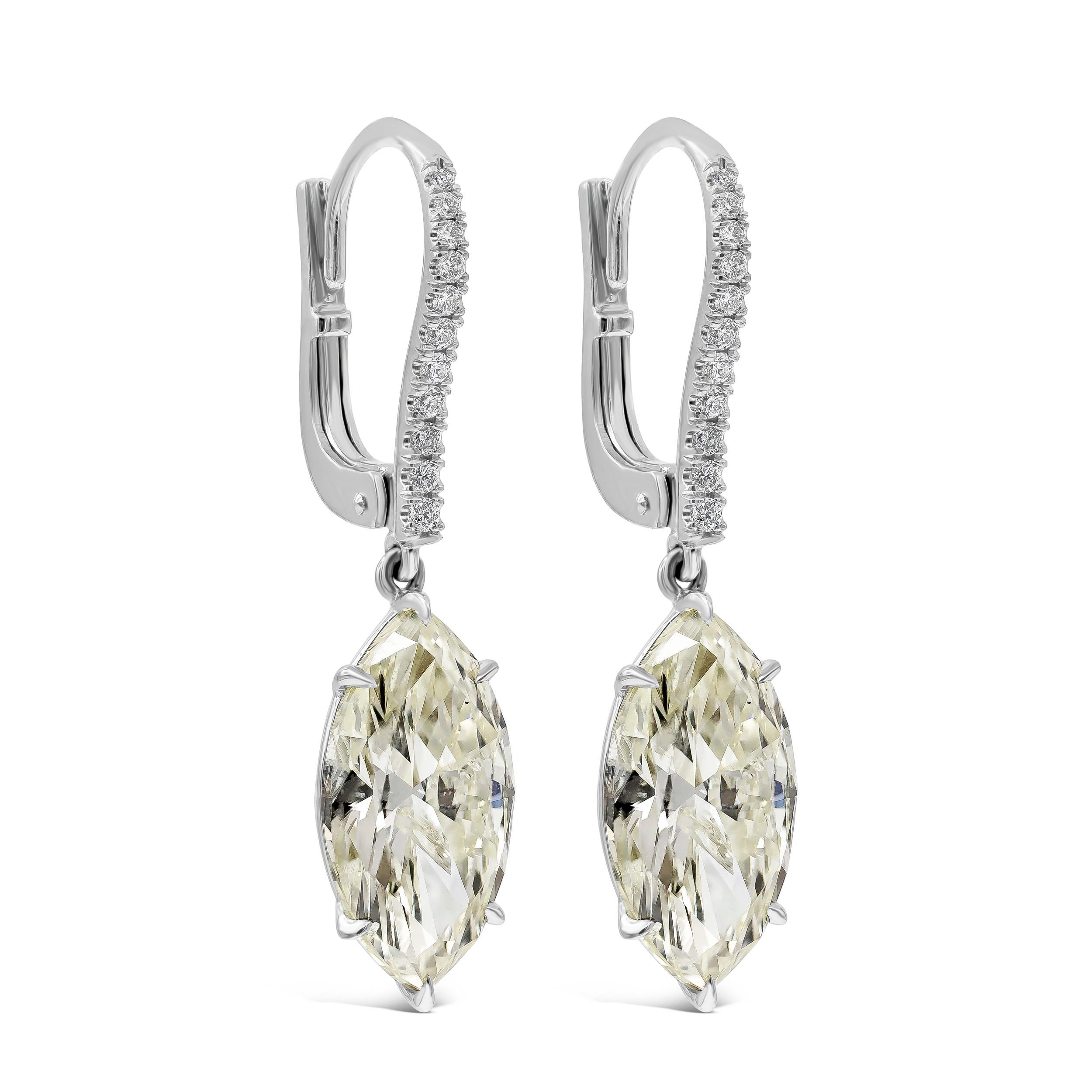 Each earring showcases a marquise cut diamond set in an elegant drop. Suspended on an accented lever-back made in 18 karat white gold. Marquise diamonds weigh 6.69 carats total and  are approximately L color, SI clarity. 

Roman Malakov is a custom