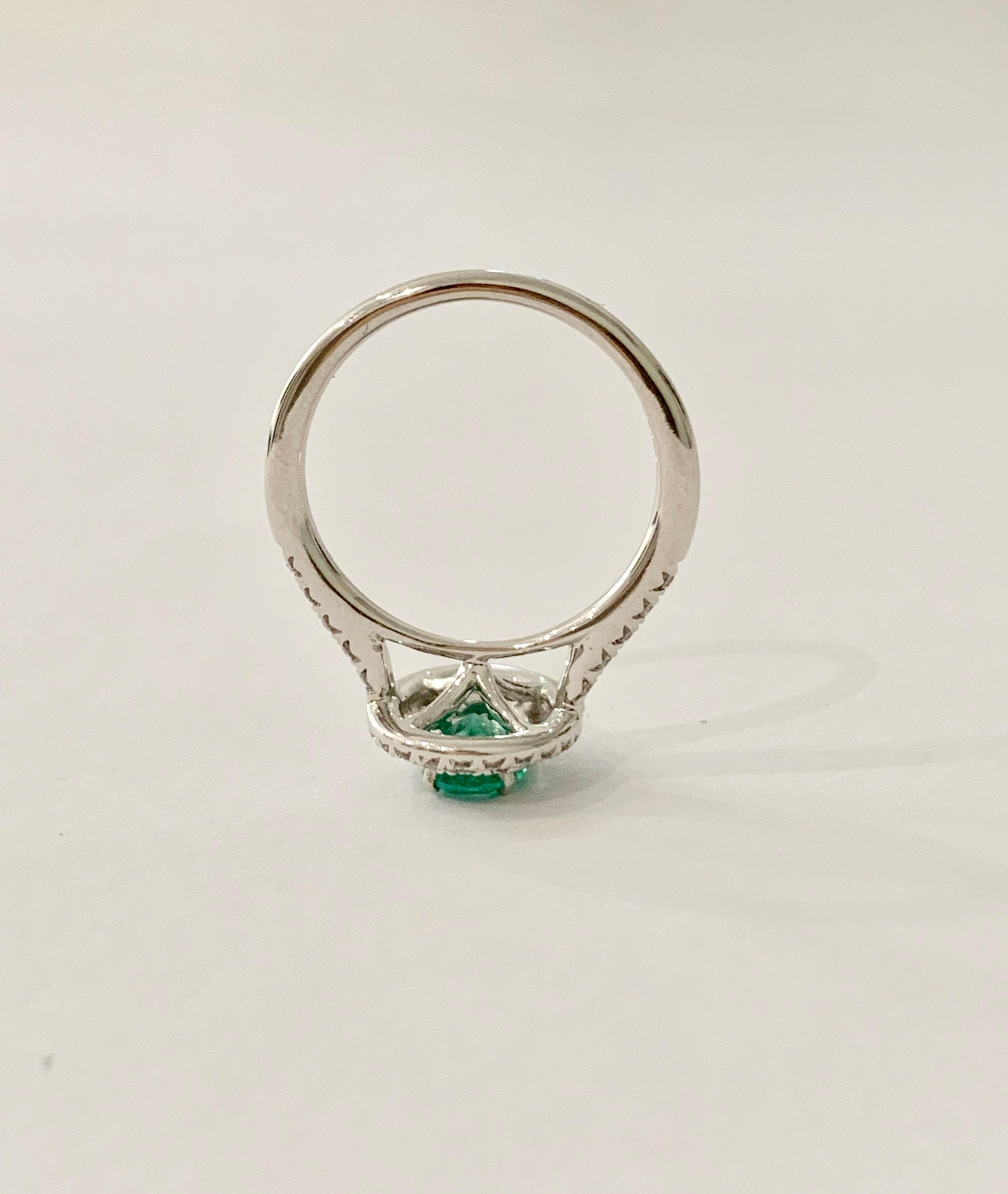 Women's .66 Carat AAAA Oval Emerald Set in Double Diamond Halo Ring in 18ct White Gold For Sale