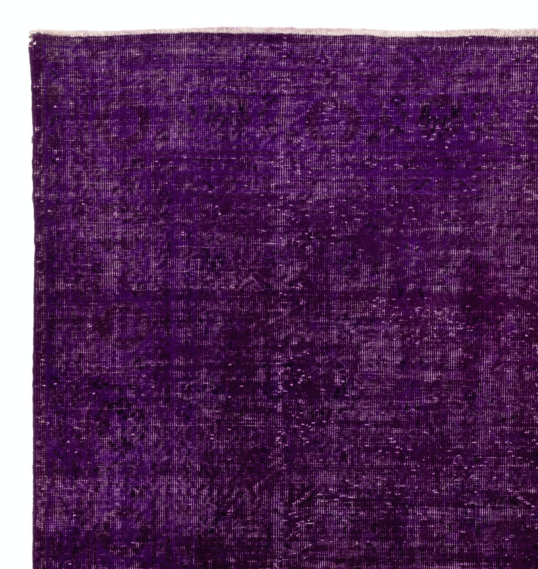 A vintage Turkish area rug re-dyed in solid purple color for contemporary interiors.
Finely hand knotted, low wool pile on cotton foundation. Professionally washed.
Sturdy and can be used on a high traffic area, suitable for both residential and