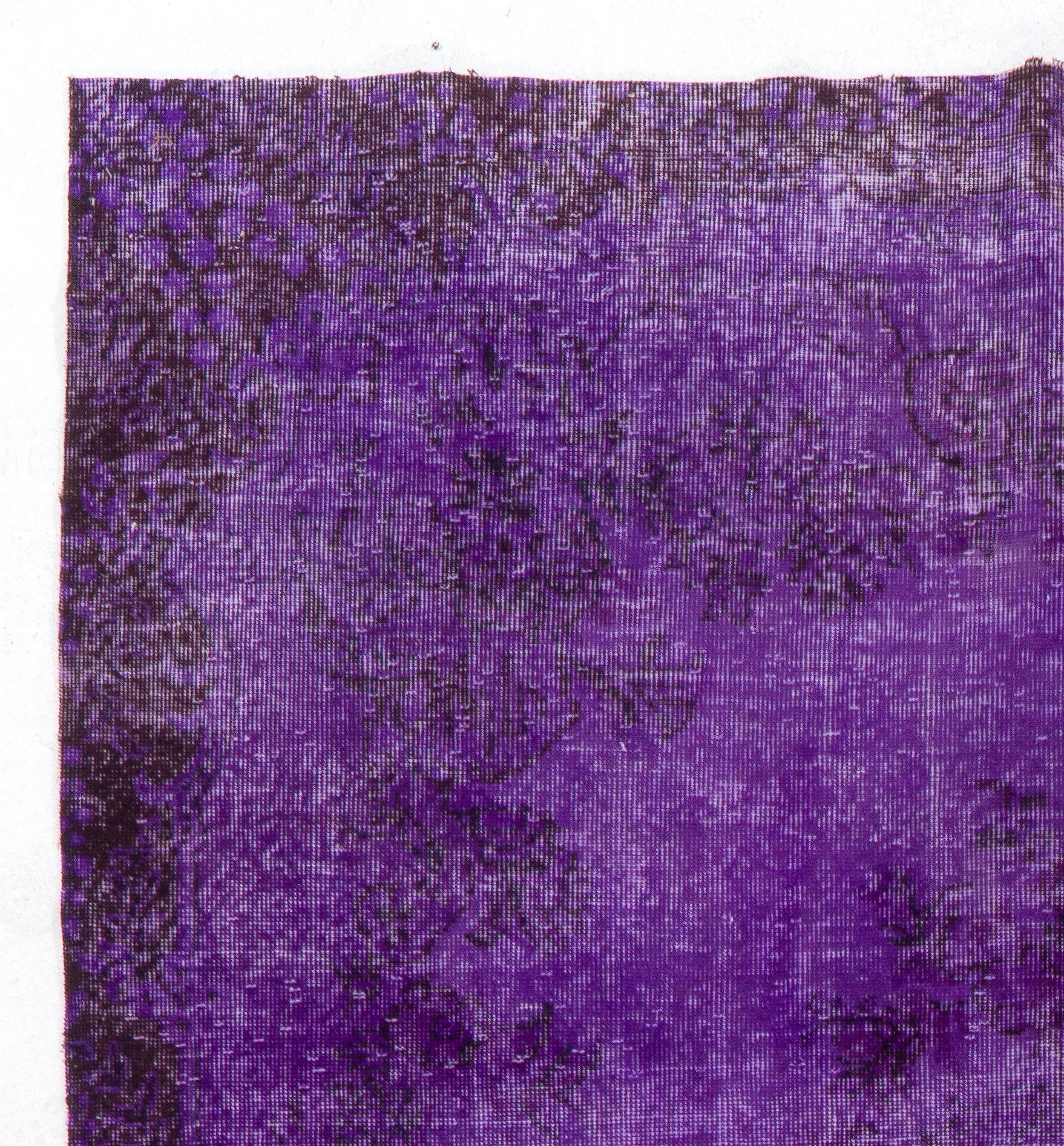 A vintage Turkish area rug re-dyed in purple color for contemporary interiors. Measures: 6.6 x 10.7 ft.
Finely hand knotted, low wool pile on cotton foundation. Professionally washed.
Sturdy and can be used on a high traffic area, suitable for