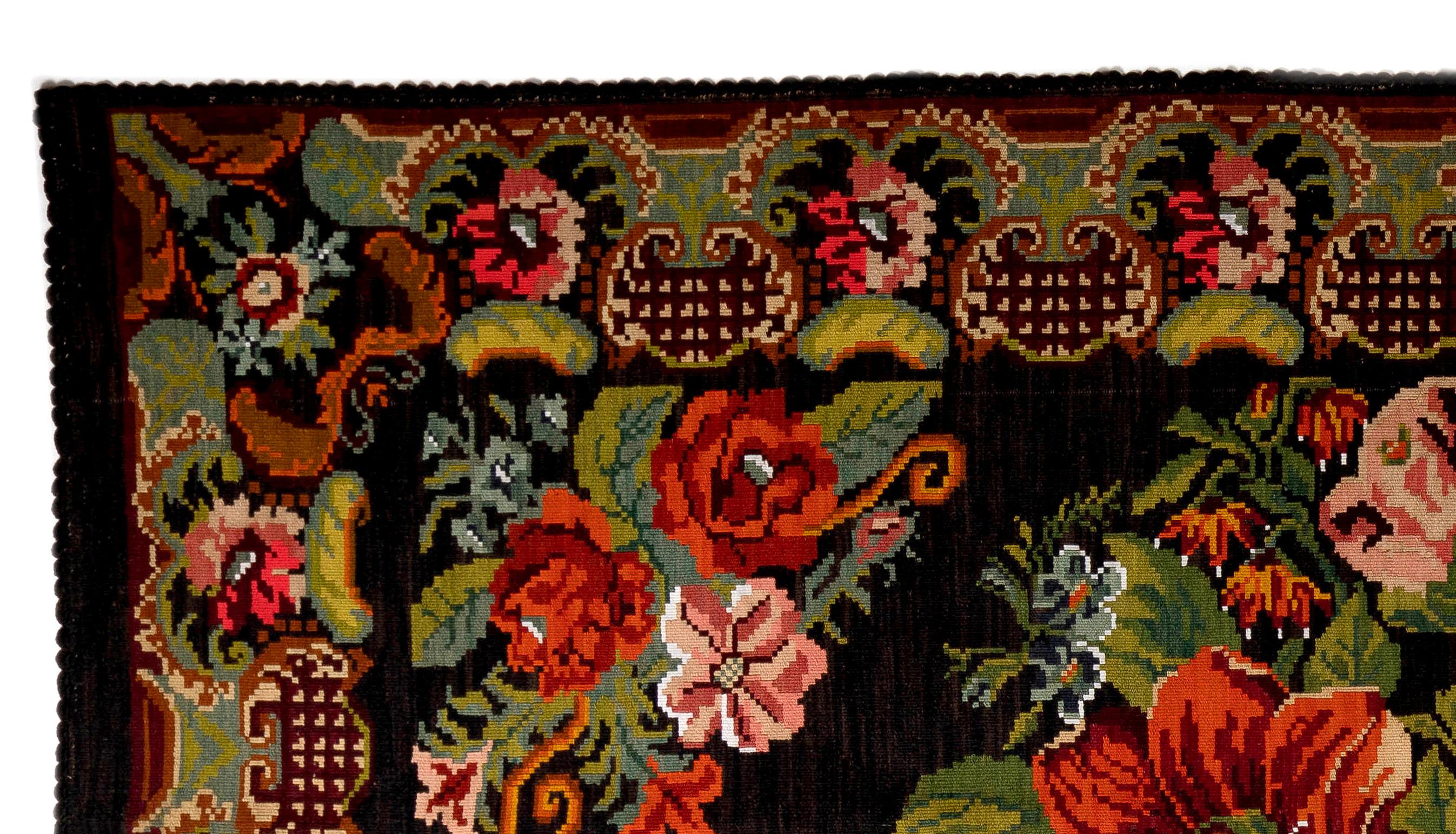One of a kind vintage Bessarabian Kilim.
A handwoven Eastern European Rug from Moldova. These traditional Moldovan flat-weaves are inspired from vintage Aubusson carpets but they are distinguished with their black grounds, large floral patterns in